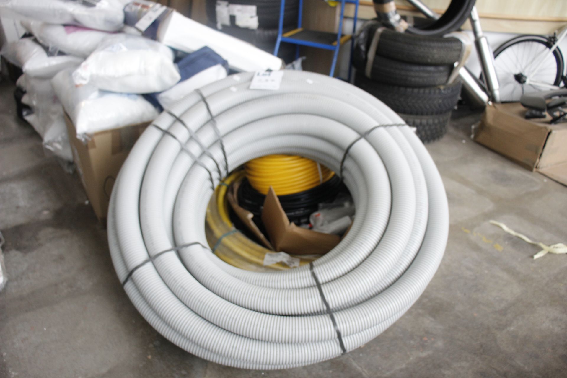 A quantity of heavy duty and industrial plastic pipes.