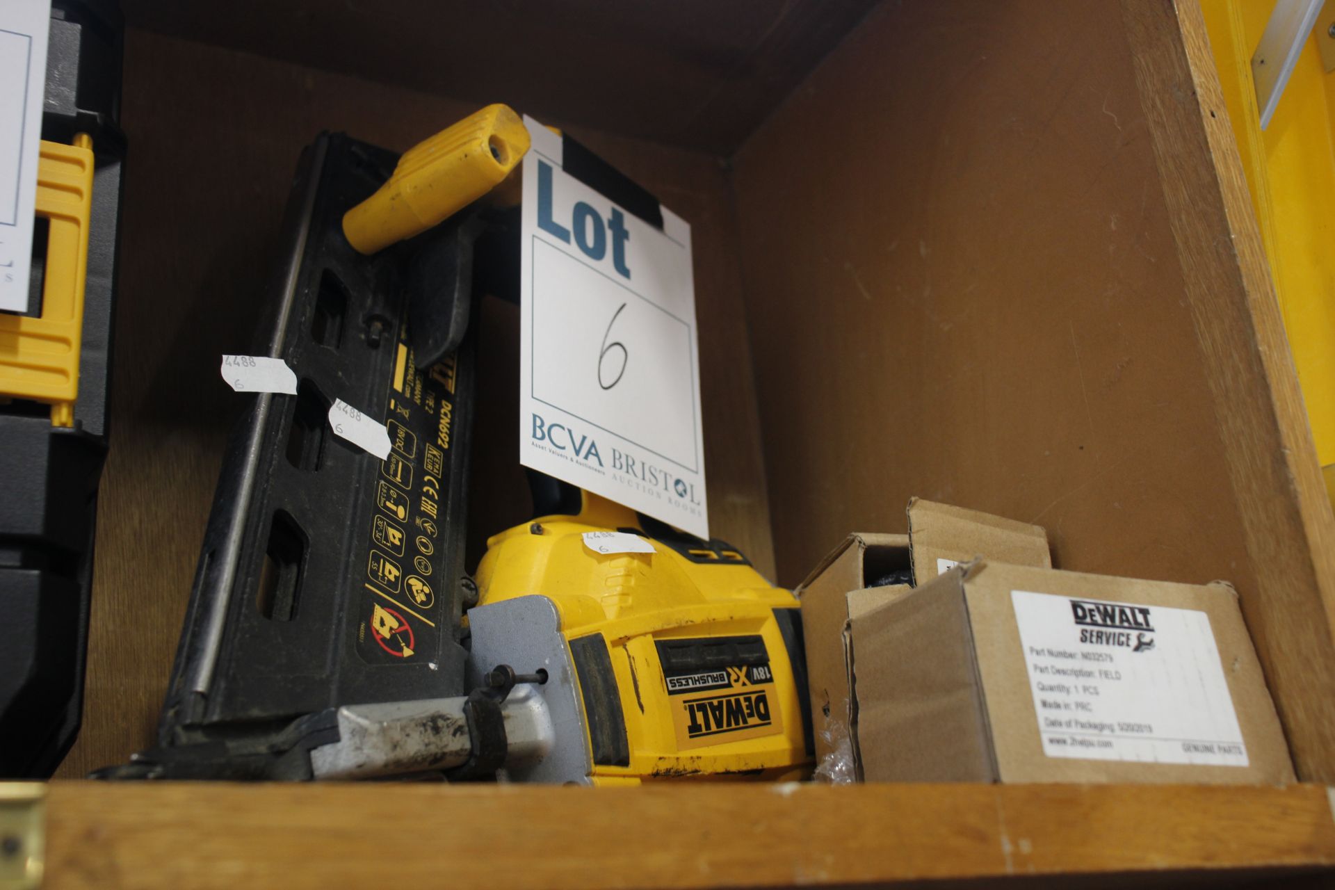 A DeWalt 18V brushless nailer, Model no. DCN692. includes two DeWalt service genuine parts.