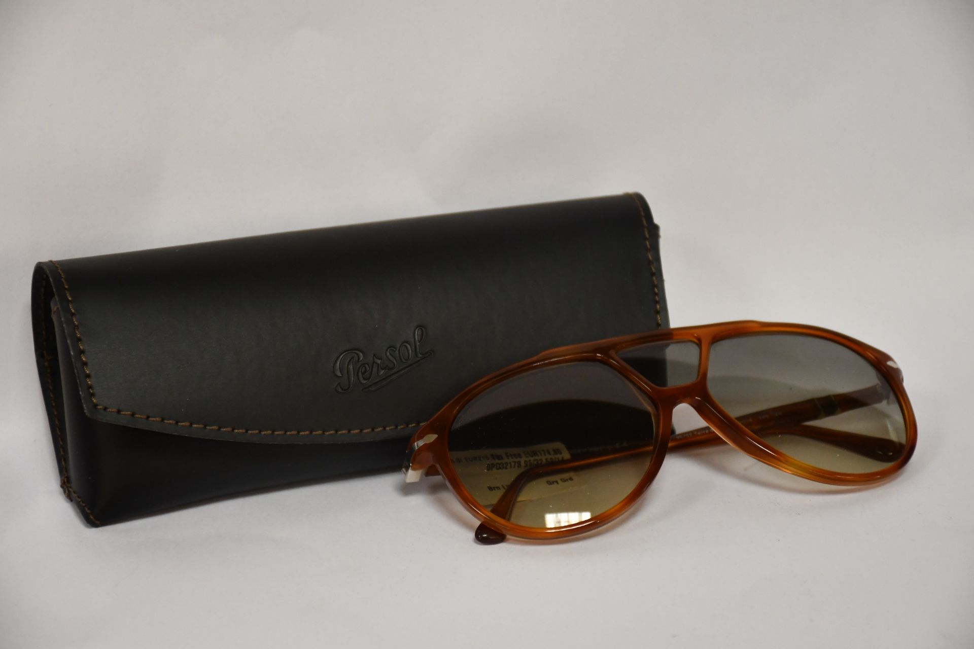 A pair of as new Persol sunglasses.