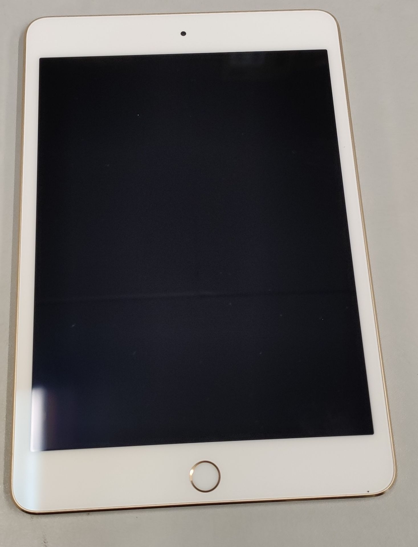 A pre-owned Apple iPad mini 4 (Wi-Fi Only) A1538 128GB in Gold (Serial: F9FTJ9YVGHKL) (iCloud