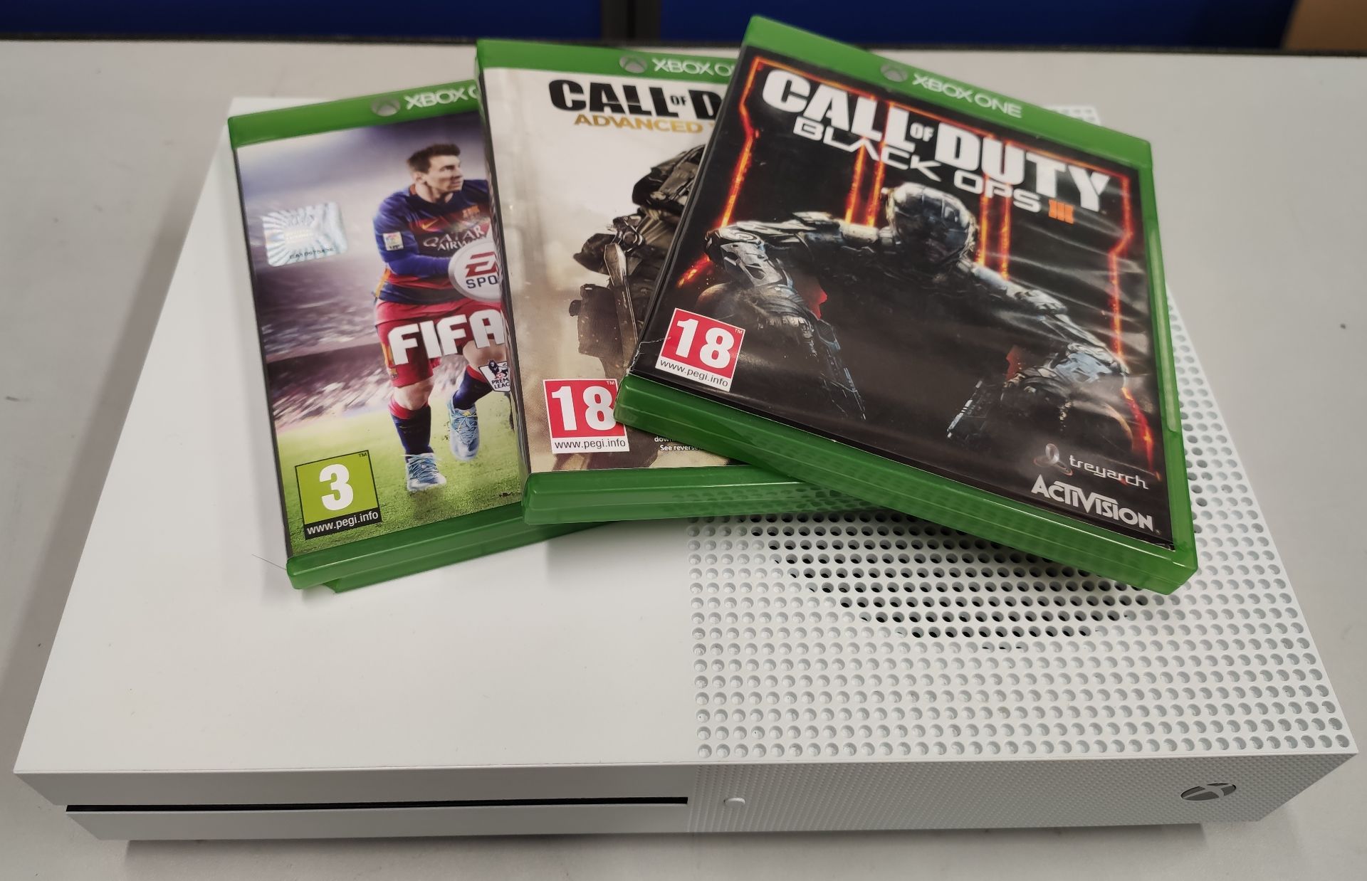 A pre-owned Xbox One S 1681 (Console only) and three pre-owned game disks; Fifa 16, Call of Duty