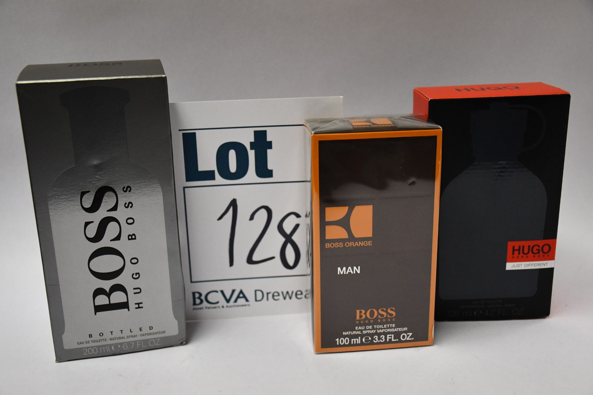 Three Hugo Boss eau de toilette; Boss Orange (100ml), Just Different (125ml) and Bottled (200ml).