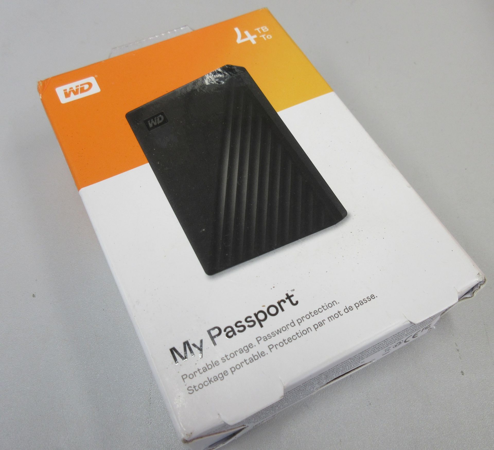 A boxed as new WD My Passport 4TB Portable Hard Drive (Box sealed).