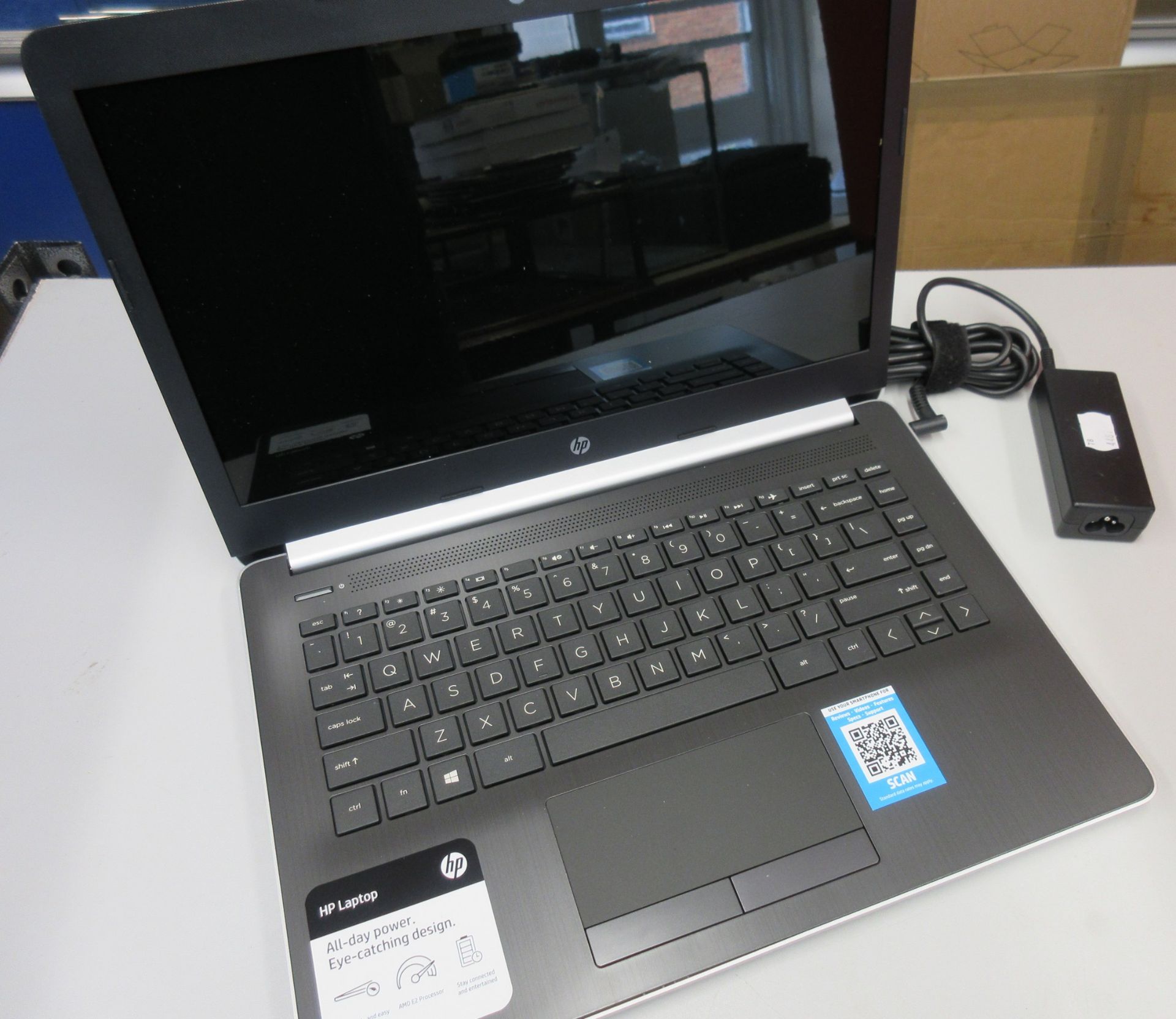 A pre-owned HP 14-cm0012nr 14" Notebook in Silver with AMD E2-9000e processor, 4GB RAM, 32GB SSD