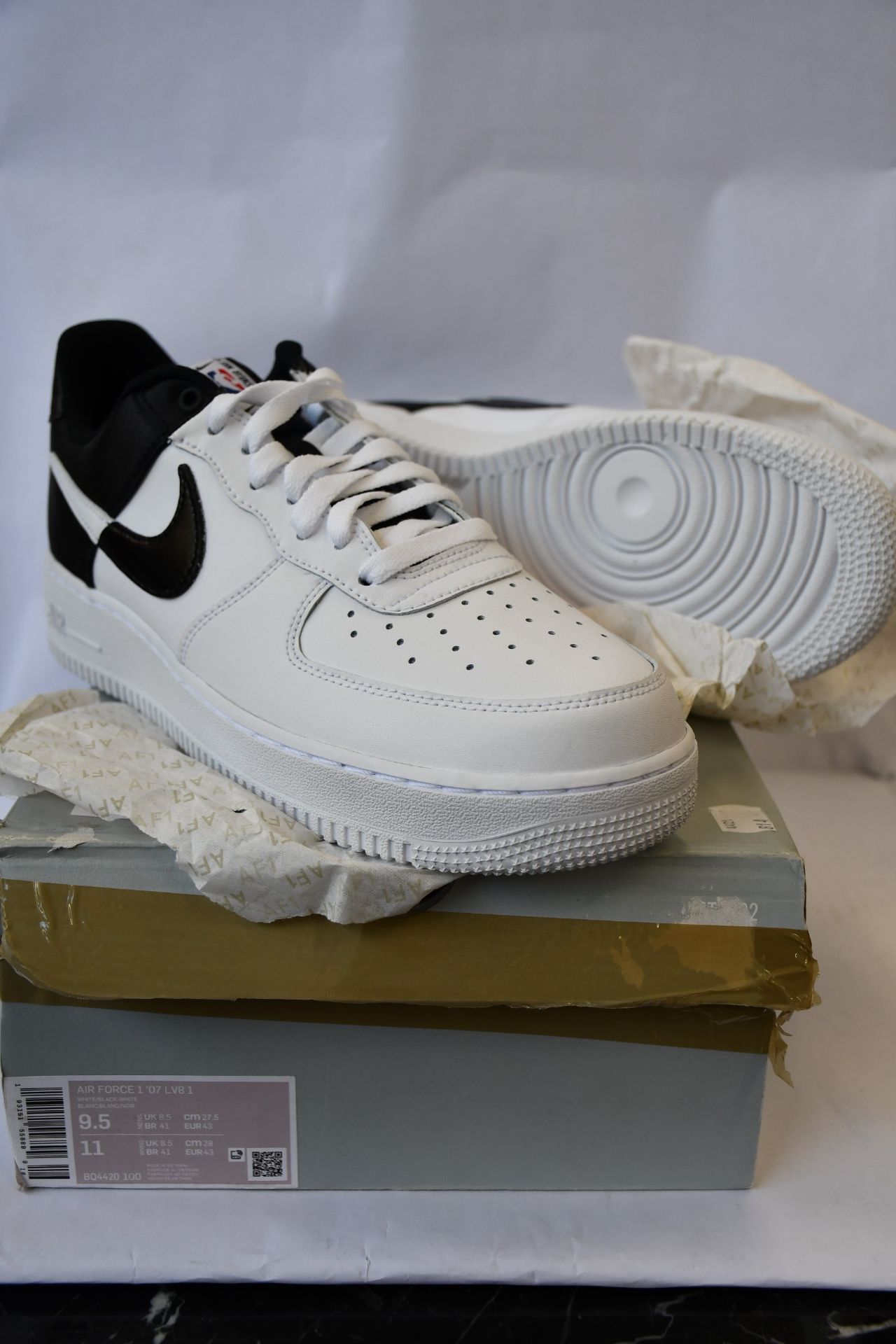 A pair of as new Nike Air Force 1 '07 LV8 1 trainers (UK 8.5).