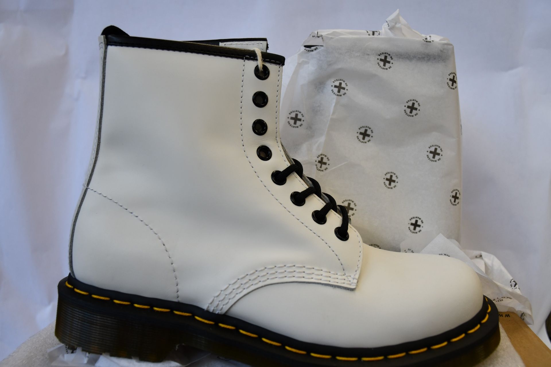 A pair of as new Dr Martens 1460 boots in white (UK 6).