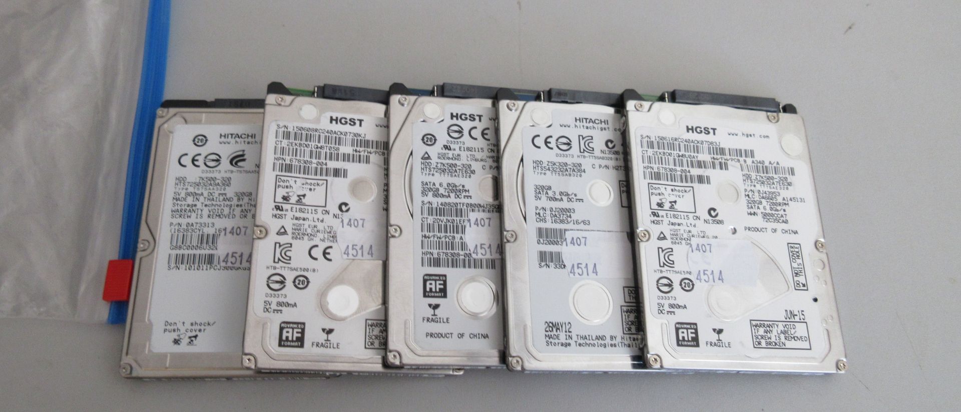 Five used Hitachi 320GB 2.5 inch SATA hard disk drives. Various models, all 320GB. Wiped and tested.