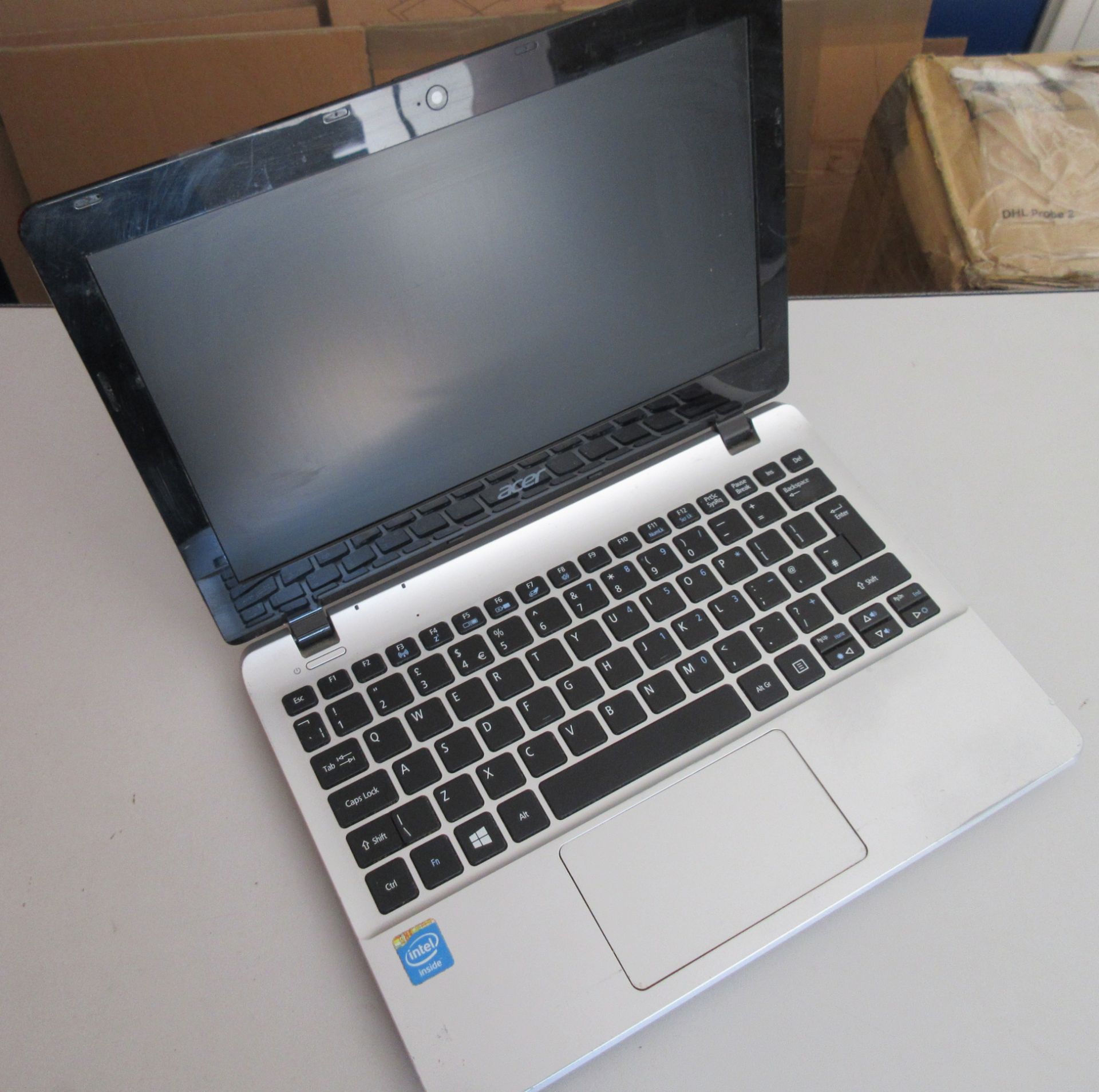 A used Acer E3-111 Laptop. Boots to BIOS, but Hard Disk removed. No power supply. Scratches to