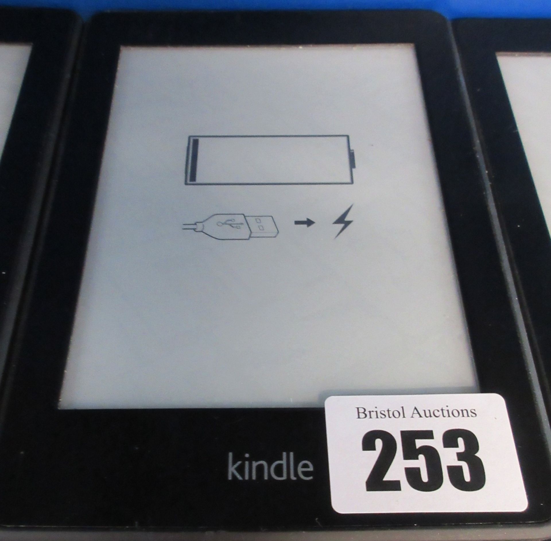 A pre-owned Amazon Kindle Paperwhite (EY21) 6” E-Reader in Black.