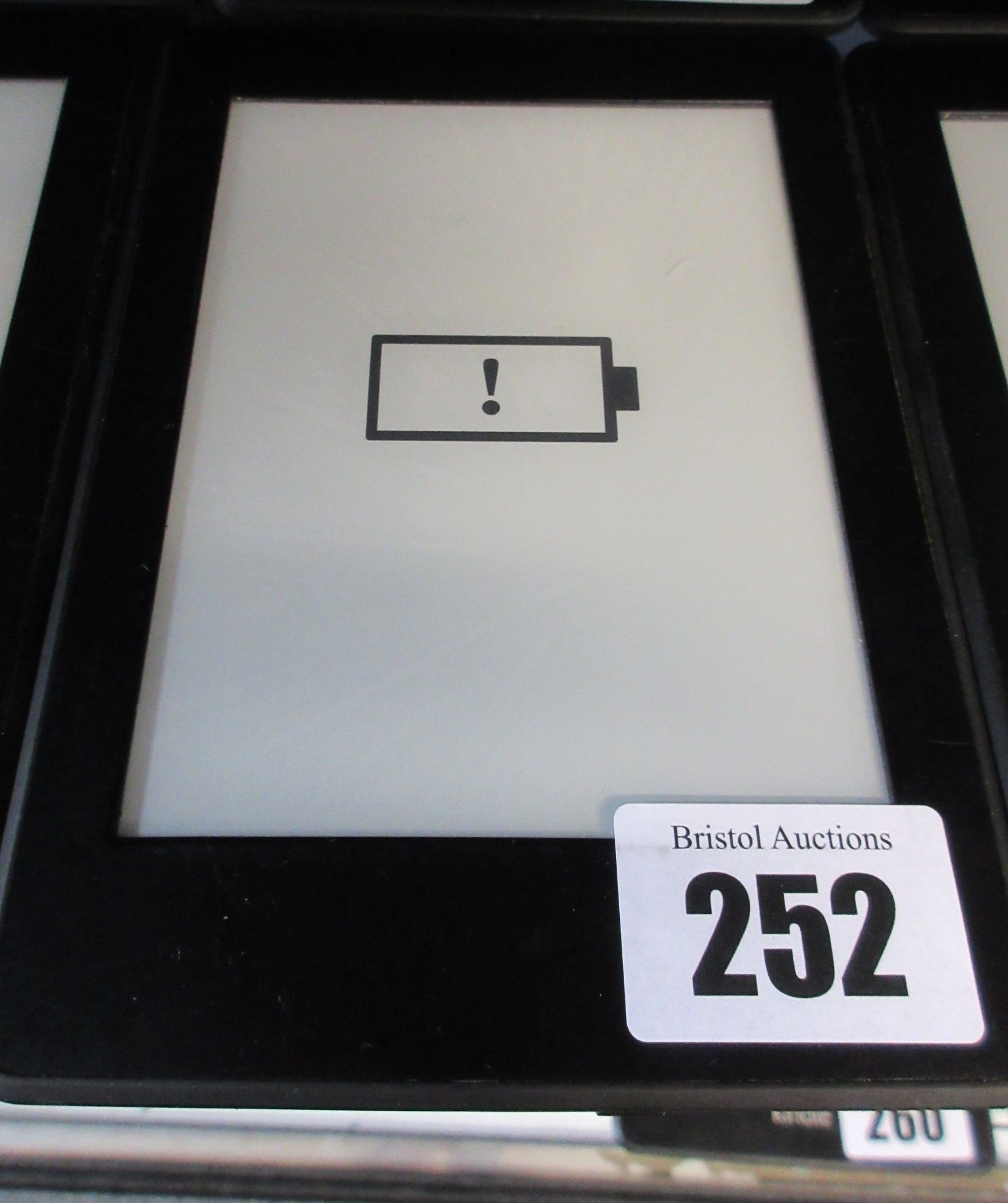 A pre-owned Amazon Kindle Paperwhite (DP75SDI) 6” E-Reader in Black (Small amount of damage to