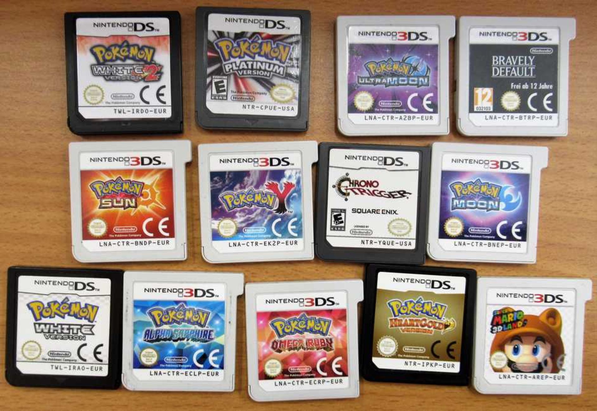 A pre-owned Nintendo 3DS Handheld Console ('New' version) in Black with thirteen assorted game cards - Image 2 of 2