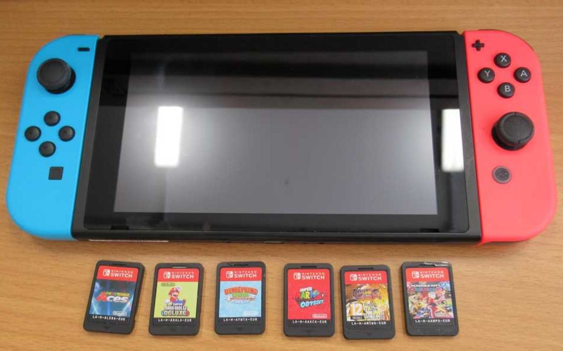 A pre-owned Nintendo Switch Console (HAC-001) with six assorted game cards. - Image 2 of 3