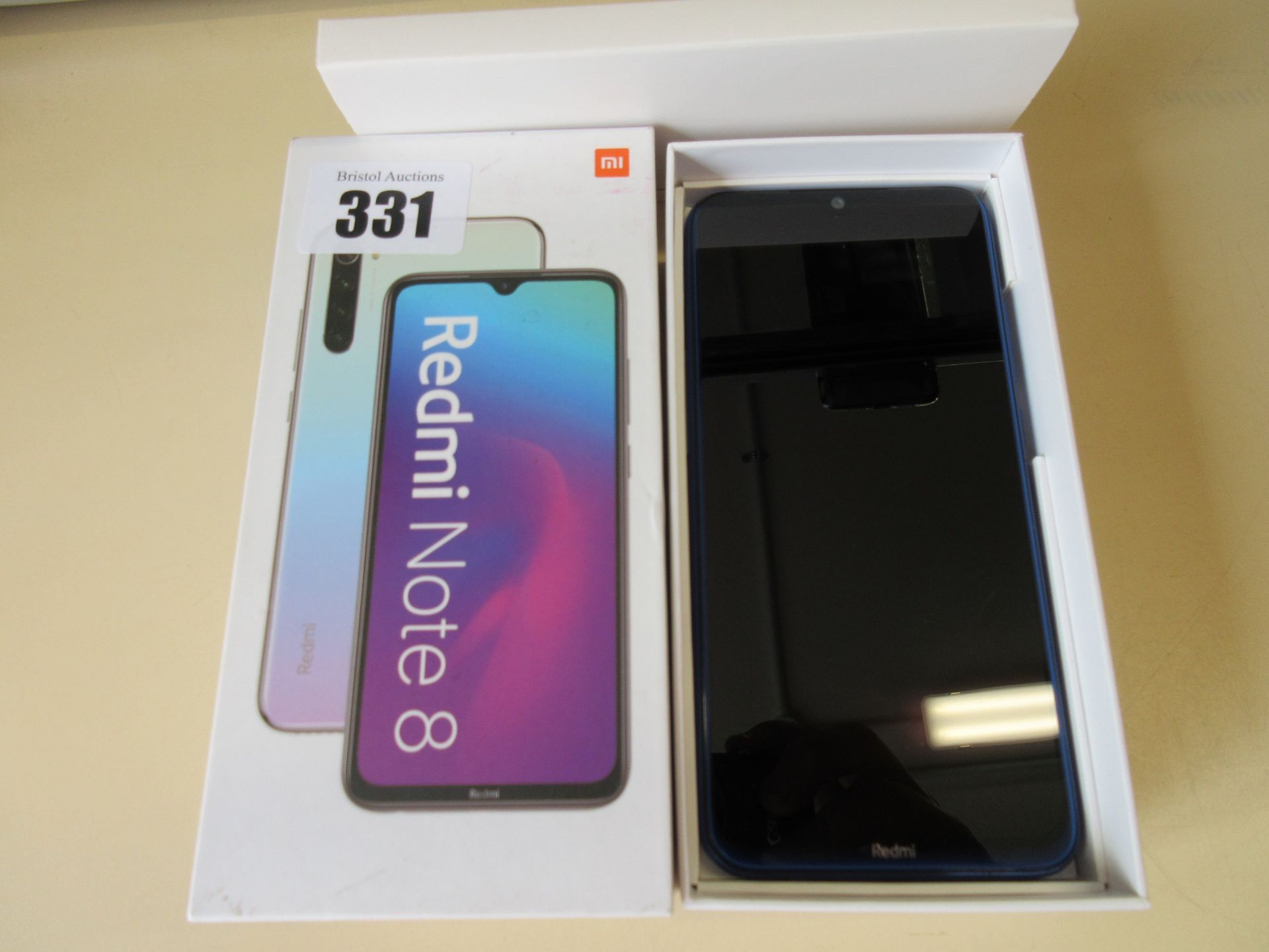 A used Redmi Note 8 4GB 64GB Android Smartphone in Neptune Blue. Good condition. Boxed with USB