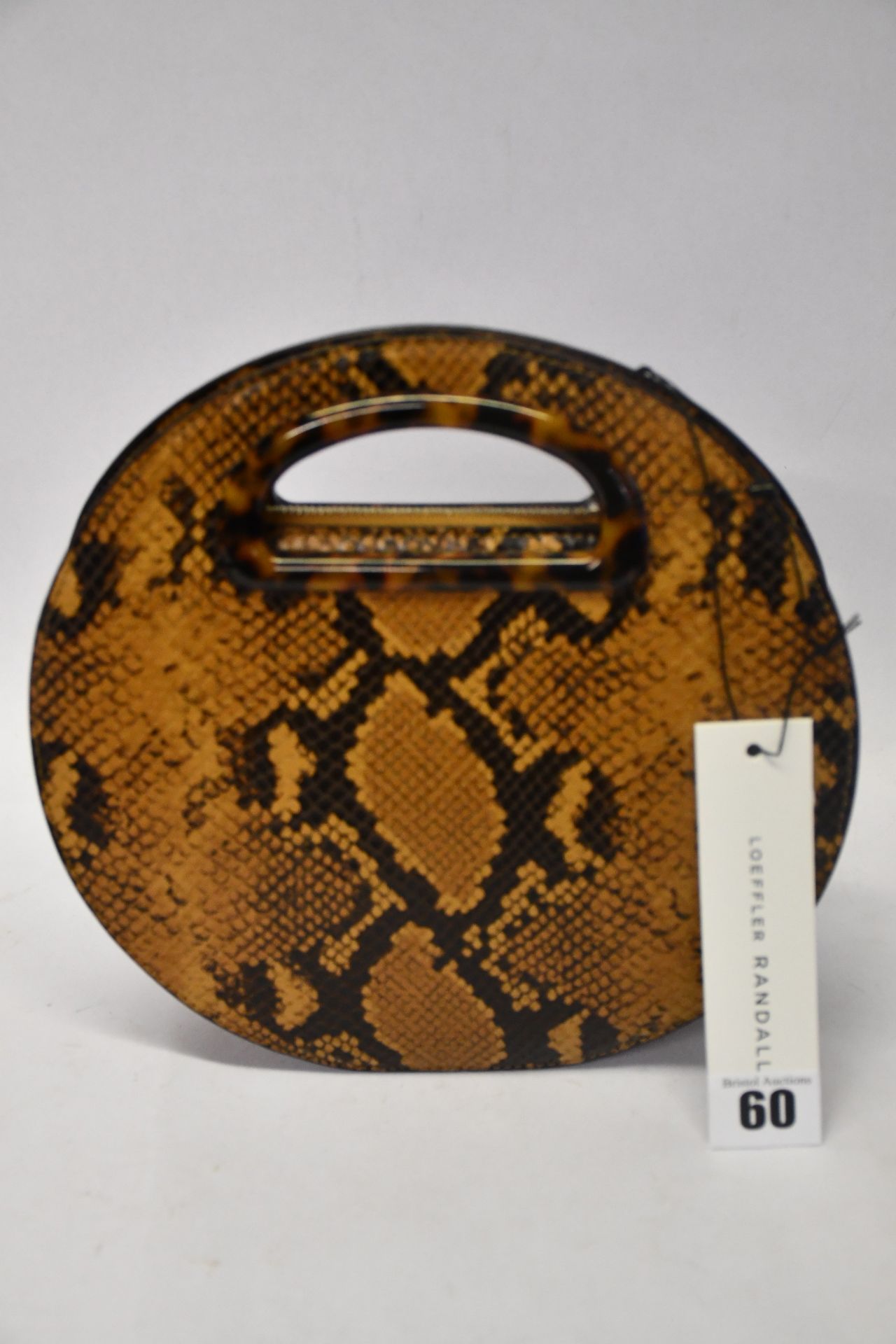 An as new Loeffler Randall Indy bag in amber (RRP $450).