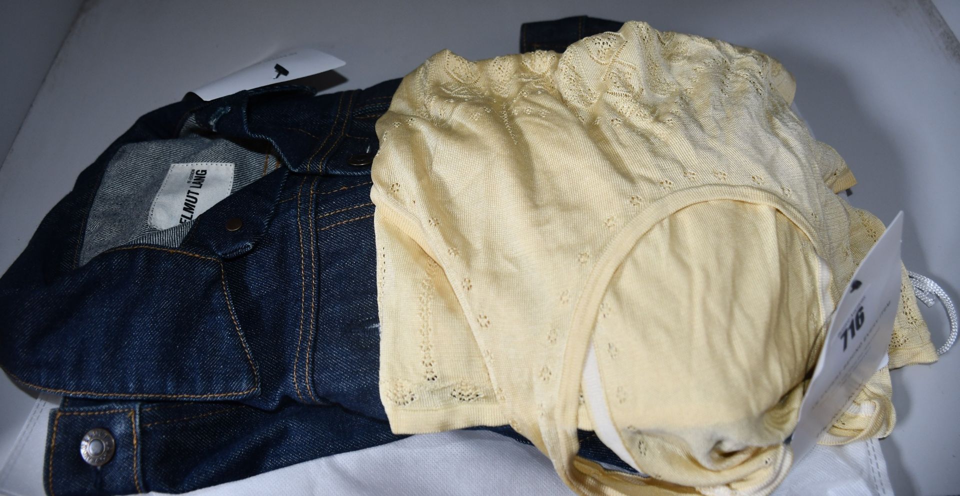 A pre-owned Alexander McQueen sleeveless eyelet top (M) and a pre-owned Helmut Lang denim jacket (