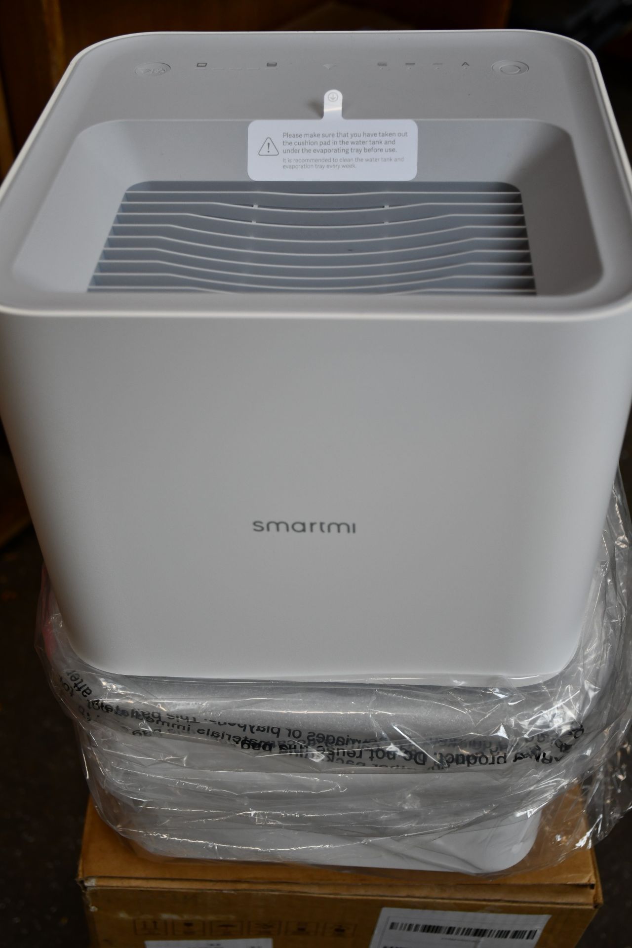A boxed as new Smartmi evaporative humidifier in white.
