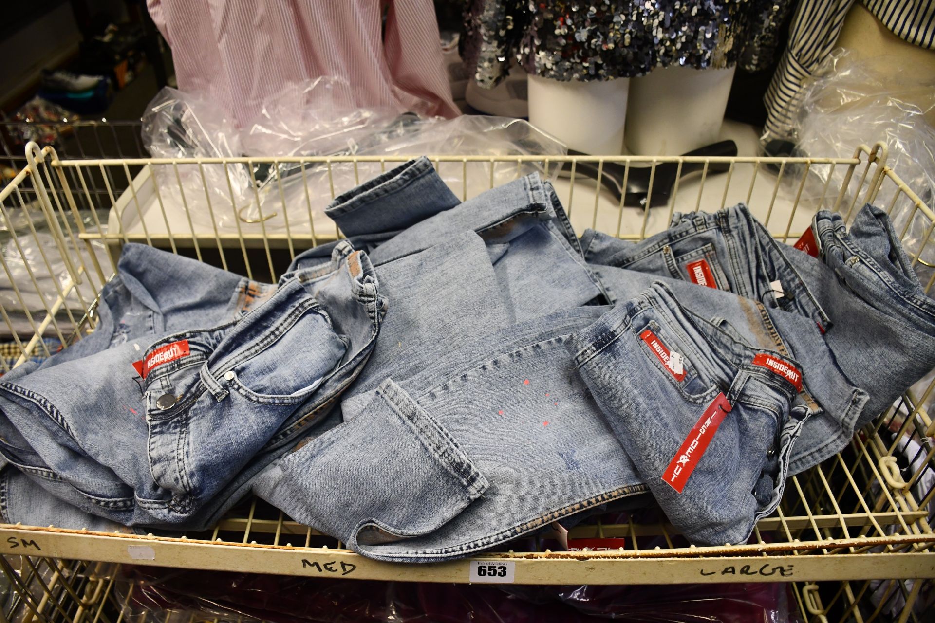 Twelve pairs of as new InsideOut denim jeans, various sizes.