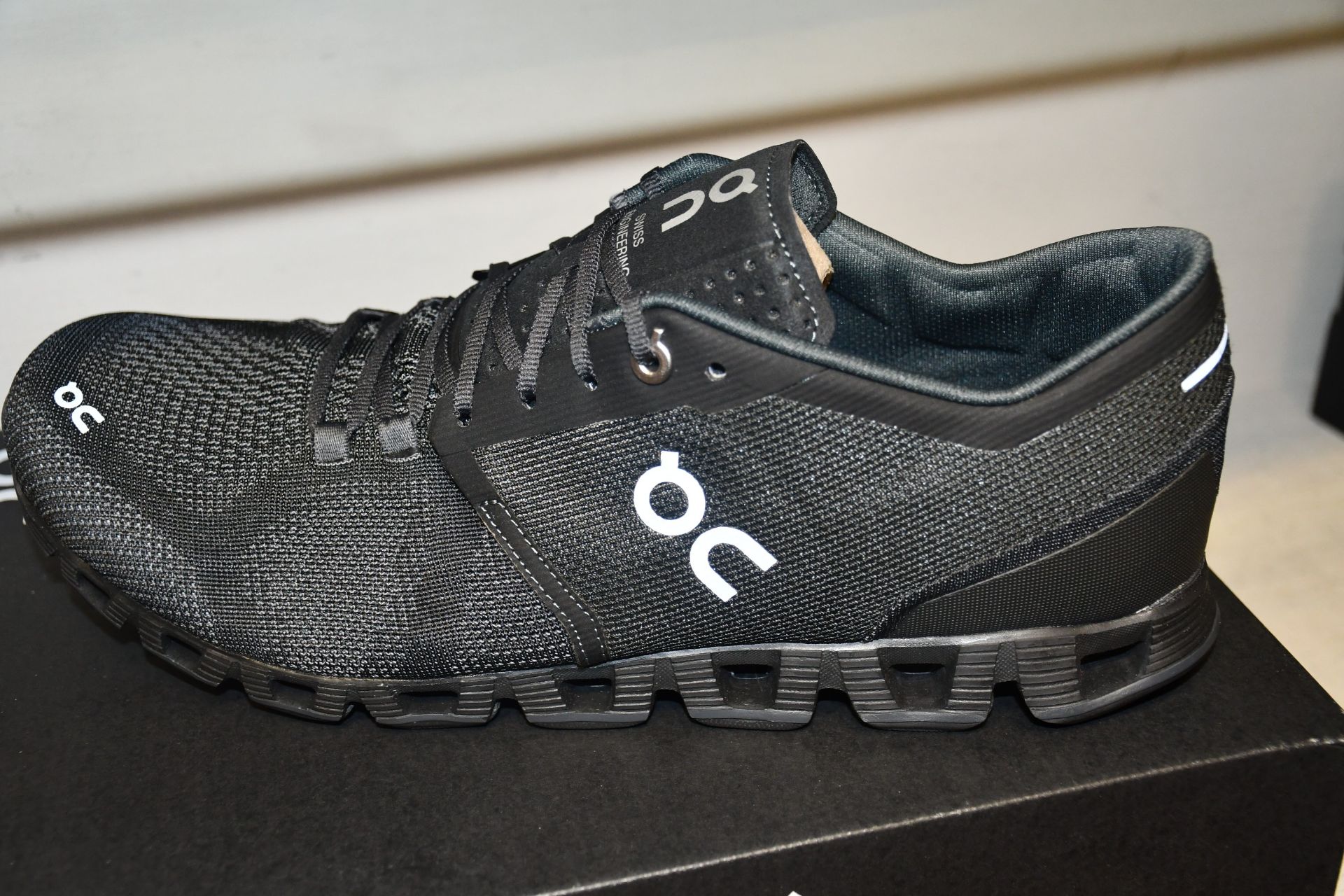 A pair of as new On Cloud X running shoes (UK 9.5).