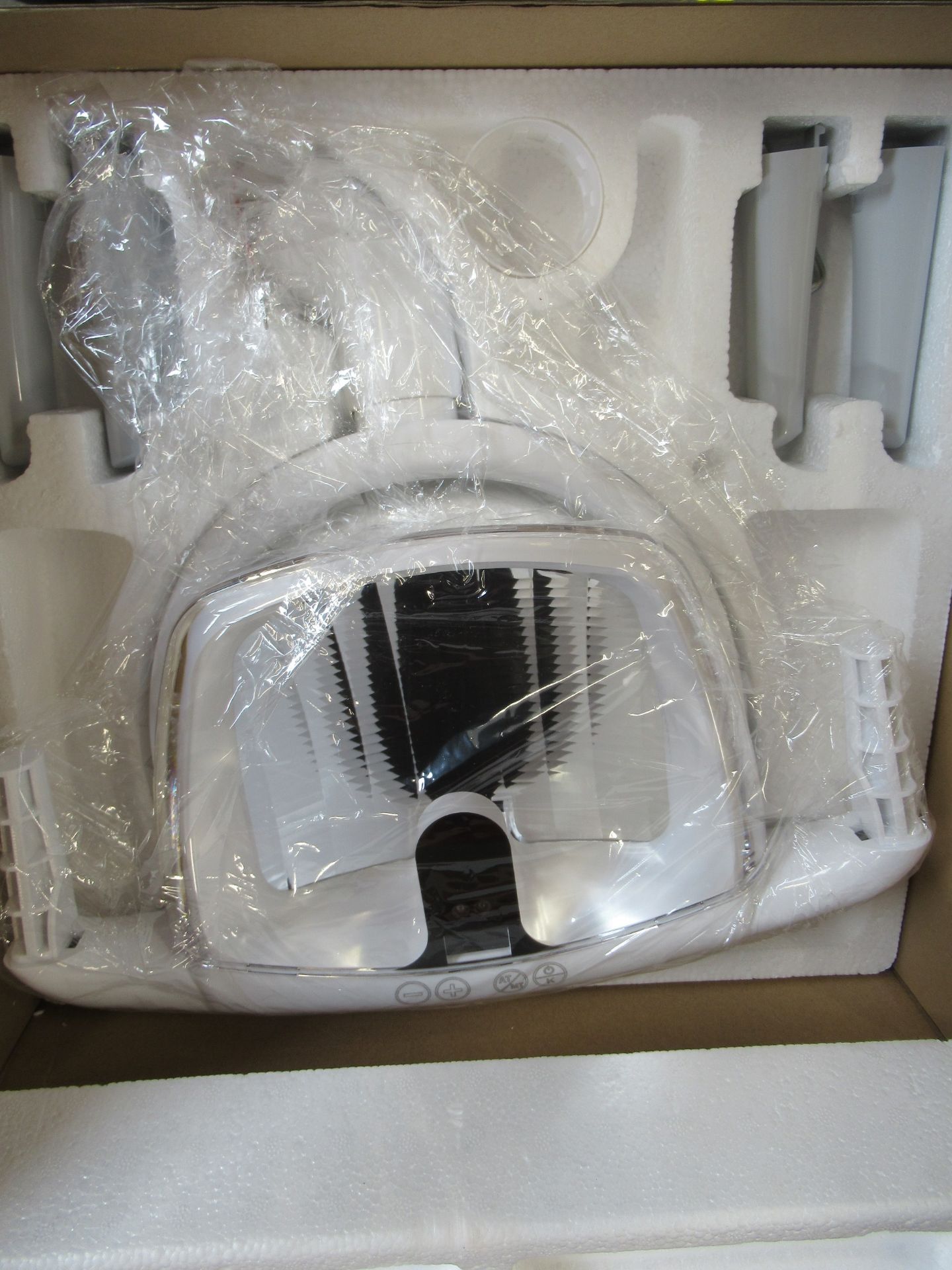 A boxed as new dentist examination light in white.