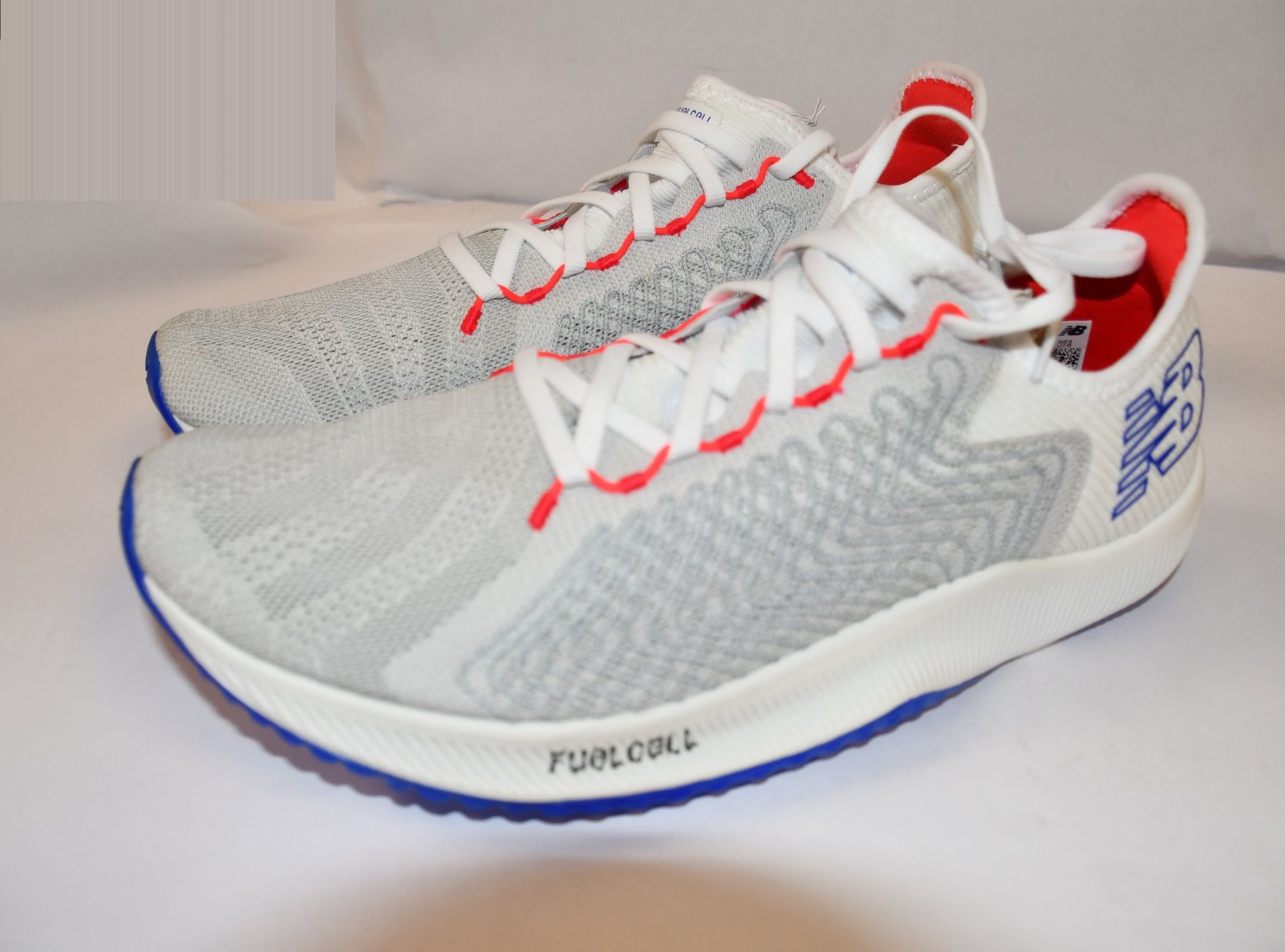 A pair of as new New Balance Fuel Cell Rebel trainers (UK 10 - No box).