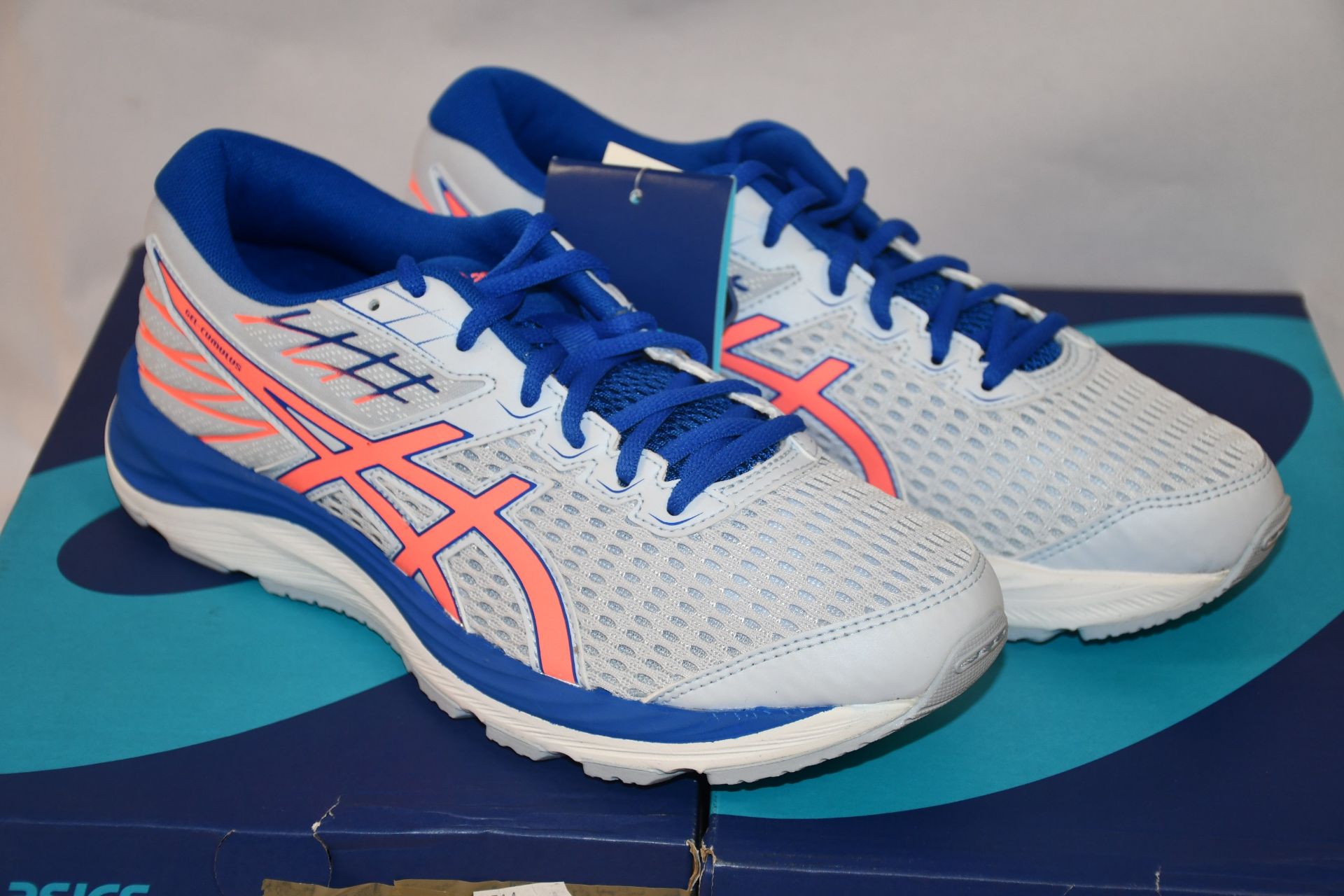 Two pairs of as new Asics Gel-Cumulus 21 GS trainers (Both UK 5.5).
