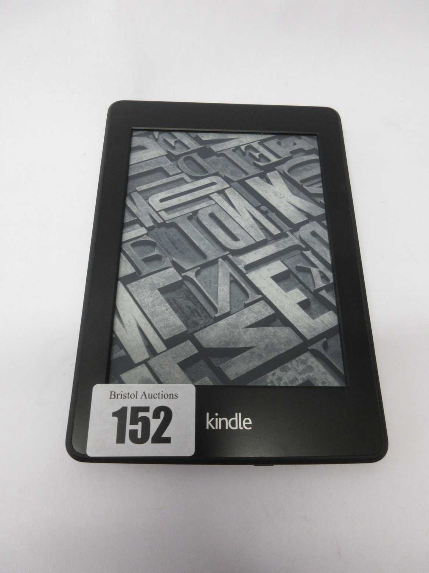 A pre-owned Amazon Kindle Paperwhite (DP75SDI) 6” E-Reader in Black.