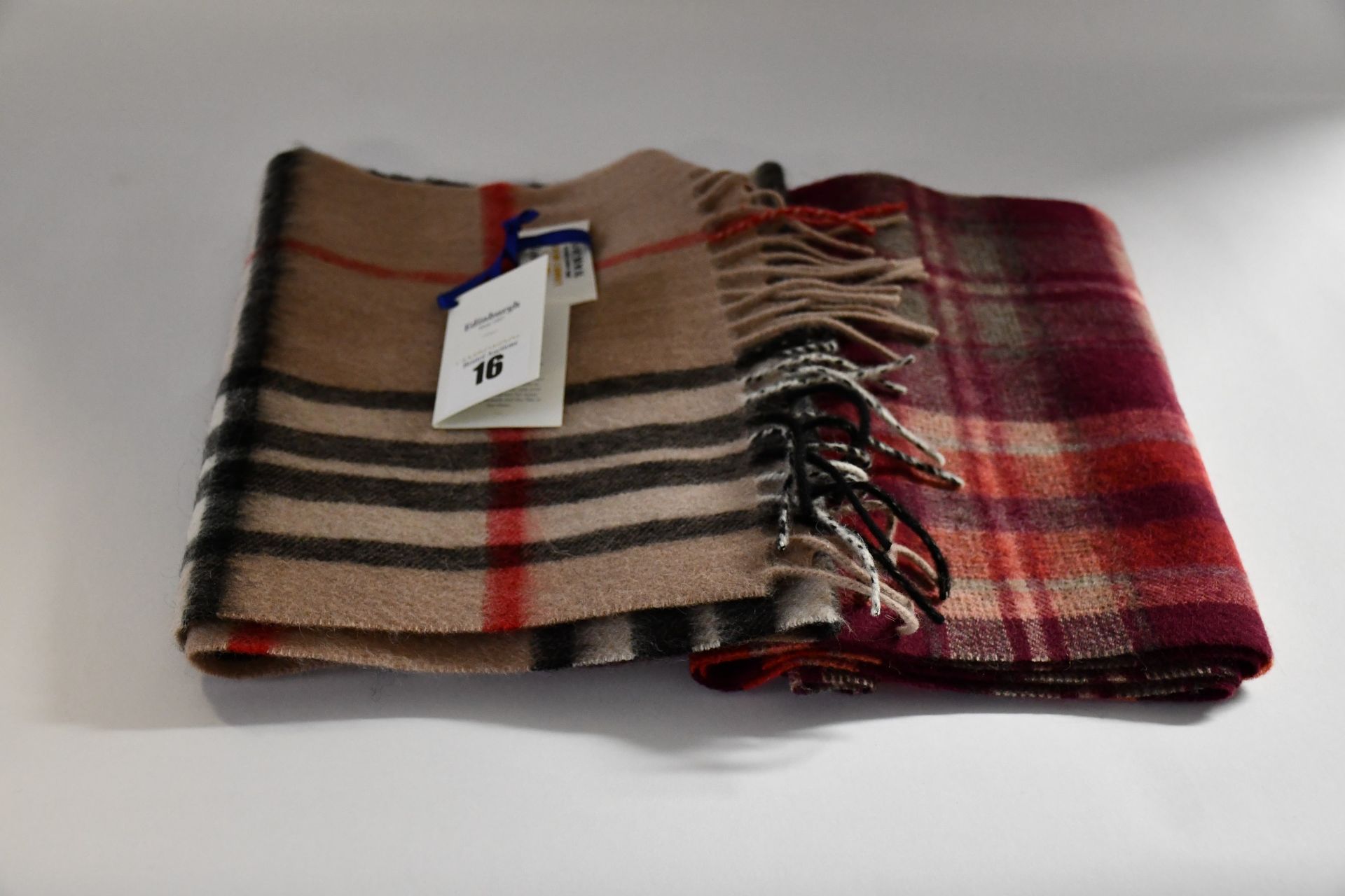 Five Lochmere 100% cashmere scarves, a Glen Appin Harris tweed flat cap (M) and eight Scottish lambs