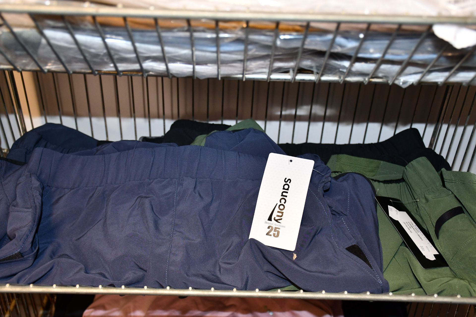 Five pairs of as new Saucony running shorts (4 x men's M, 1 x ladies S).