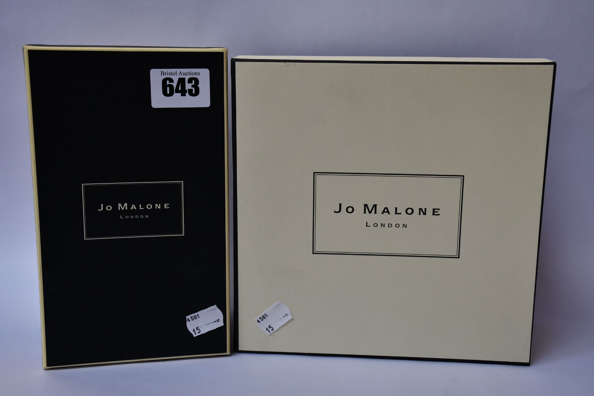 Two Jo Malone scented candles to include Orange Bitter and Dark Amber & Ginger Lily.