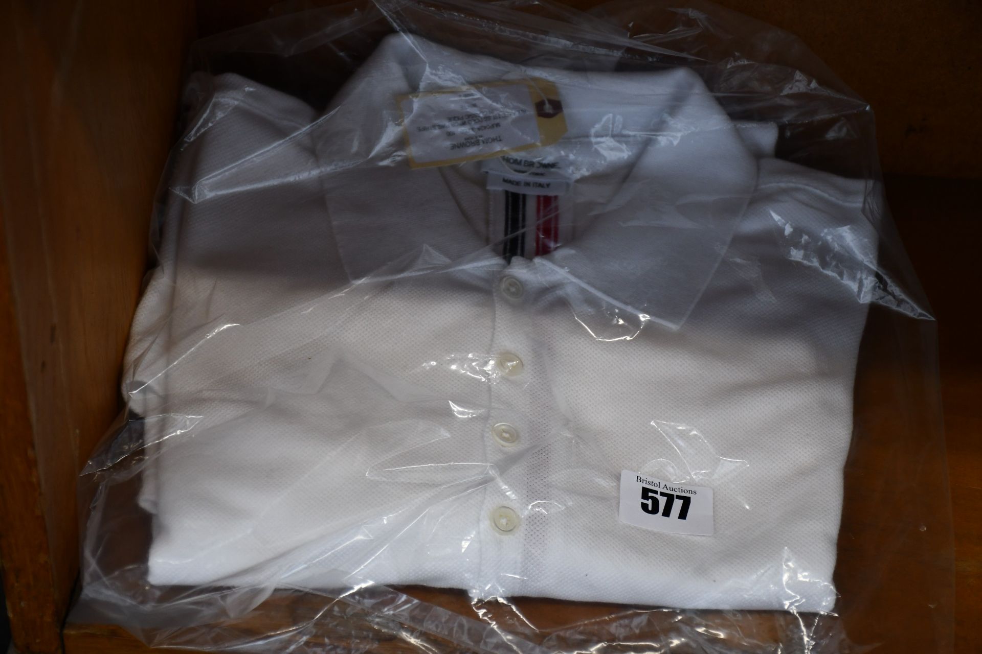 An as new Thom Browne white polo shirt (Size 2).