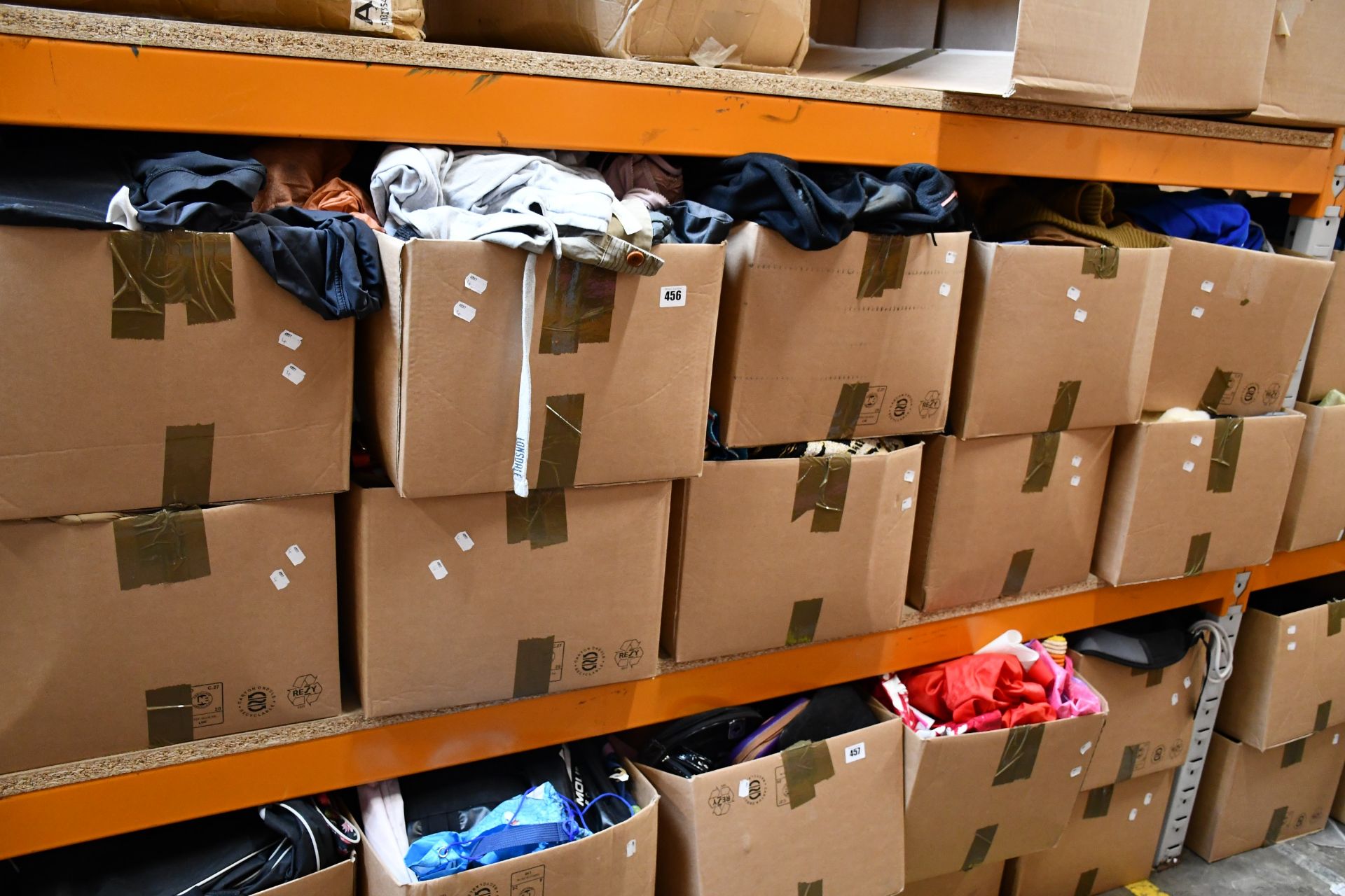 Ten boxes of assorted clothing and related items.