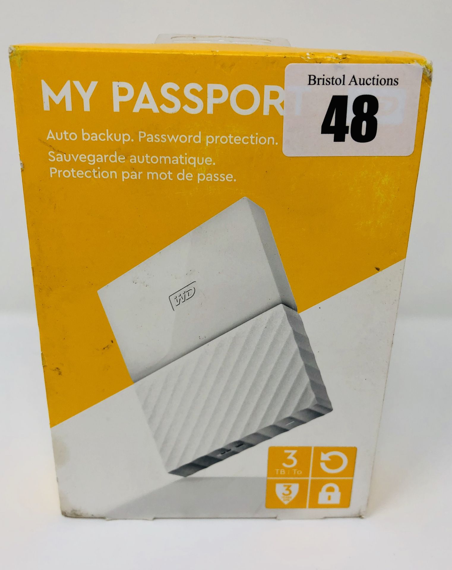 A boxed as new WD My Passport 3TB Portable Hard Drive in White (Box sealed, some cosmetic damage