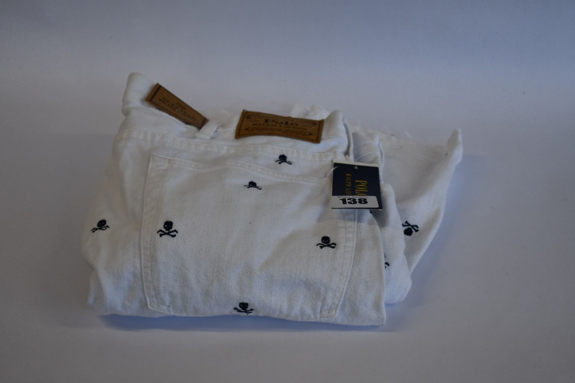 A pair of as new Ralph Lauren The Sullivan slim crop jeans in white with skulls (38 - RRP £99). - Image 3 of 3