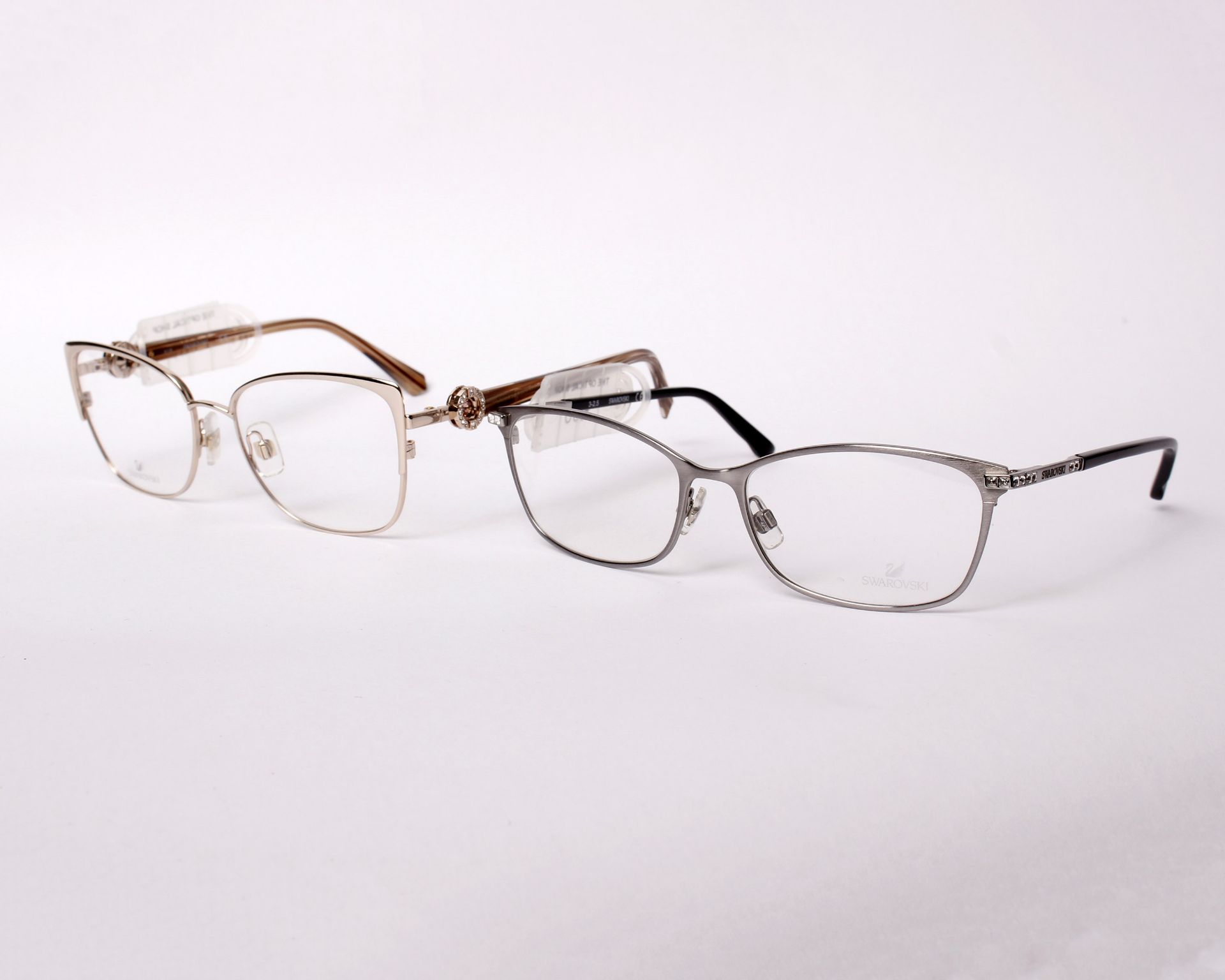 Two pairs of as new Swarovski glasses frames with clear glass (RRP £90 and £120).