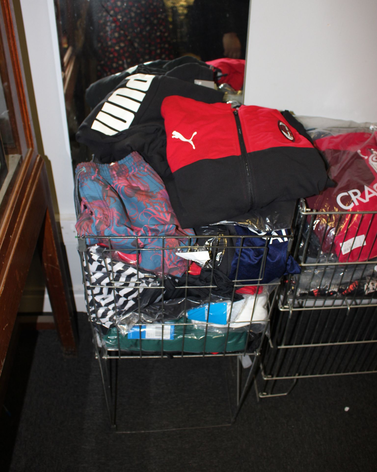 One basket full of miscellaneous sportswear to include Puma, Nike and Under Armour.