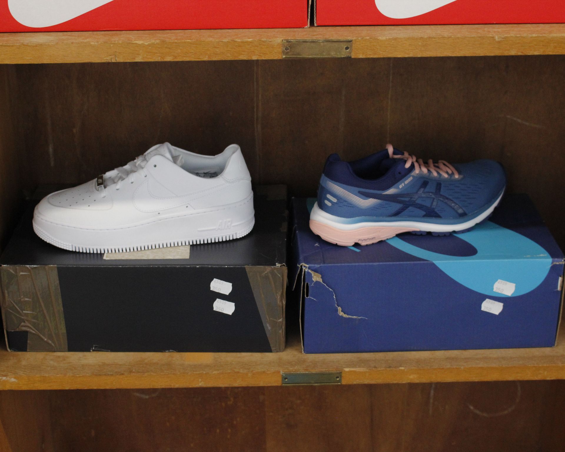 One pair of lady's boxed as new AF1 Sage Low trainers in white (UK 6) and one pair of lady's Asics