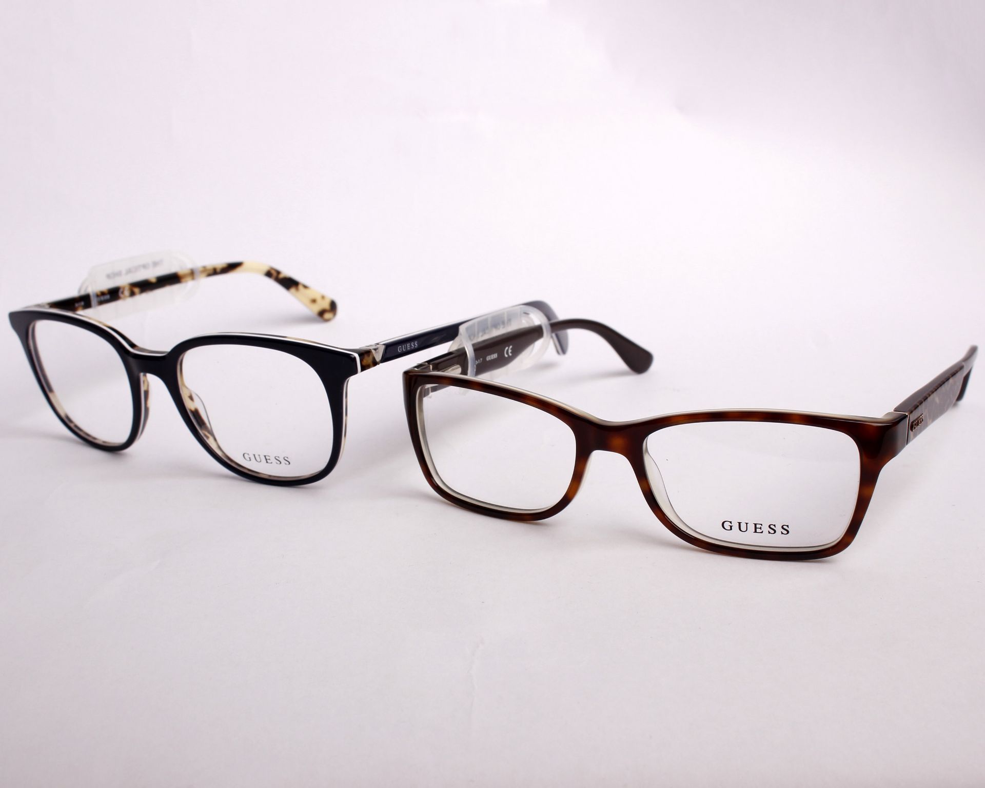 Two pairs of as new Guess glasses frames with clear glass (RRP £150 each).