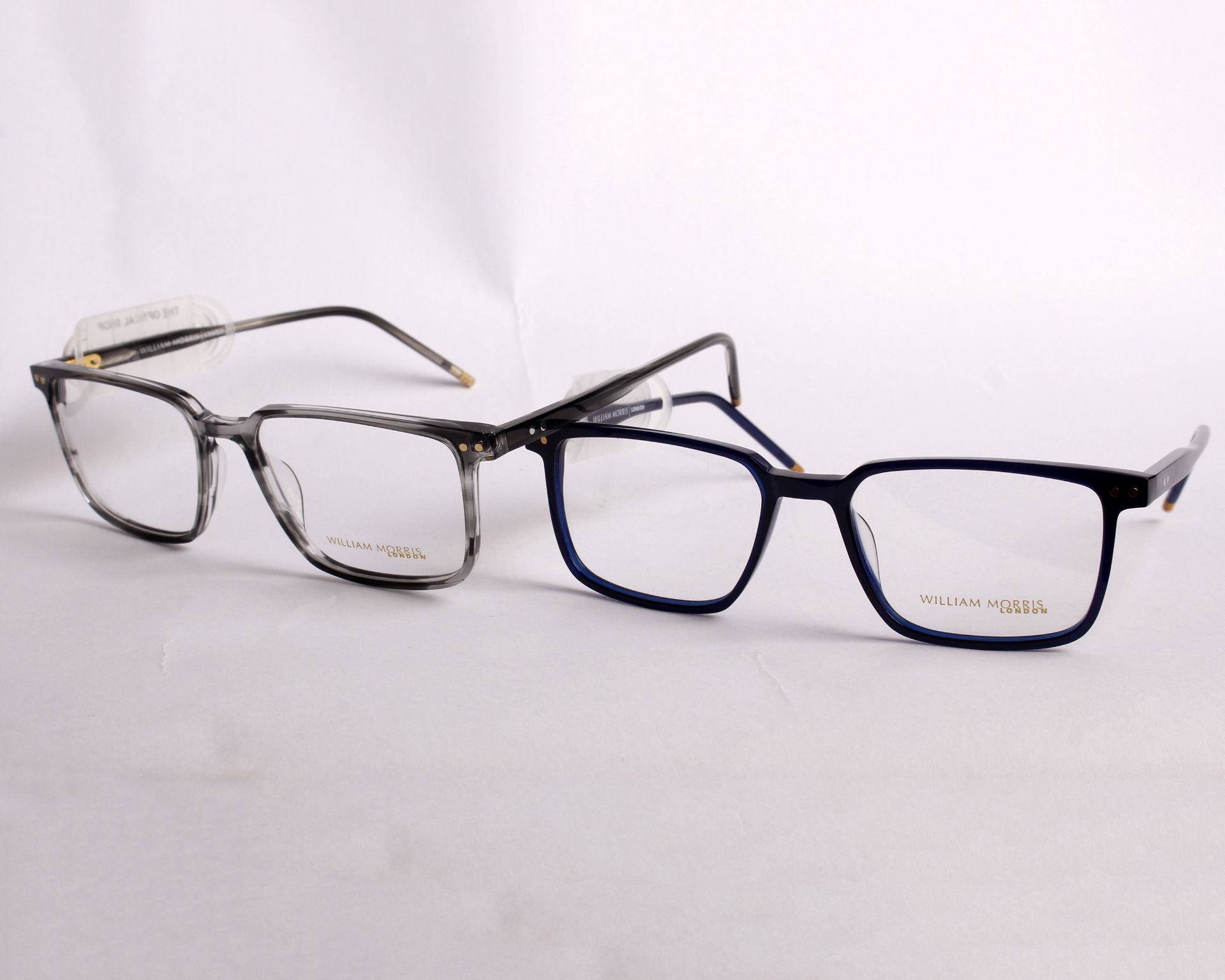 Two pairs of as new William Morris glasses frames with clear glass (RRP £170).