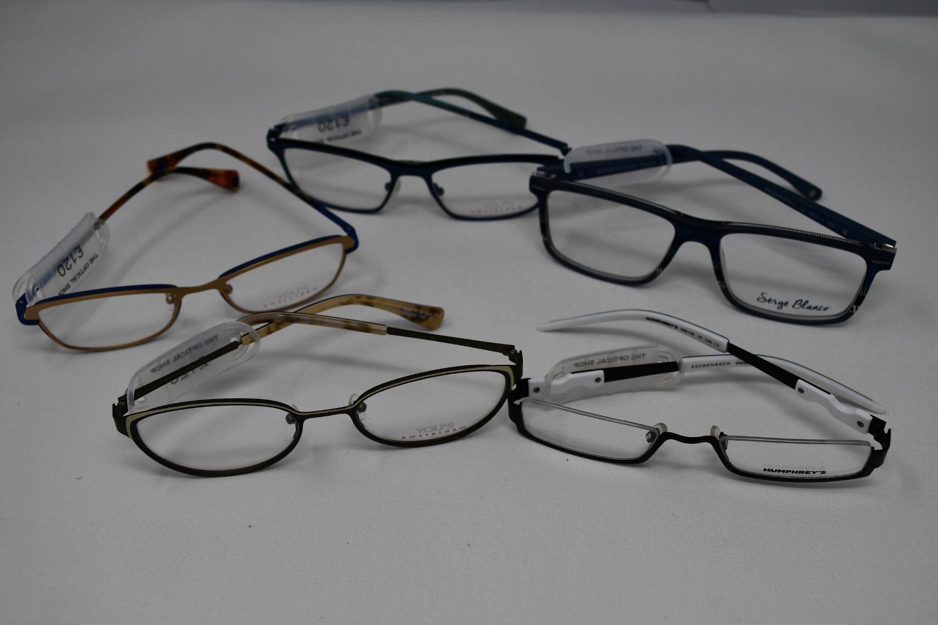 Five pairs of as new glasses frames with clear glass to include Yous, Serge Blanco and Humphrey's (