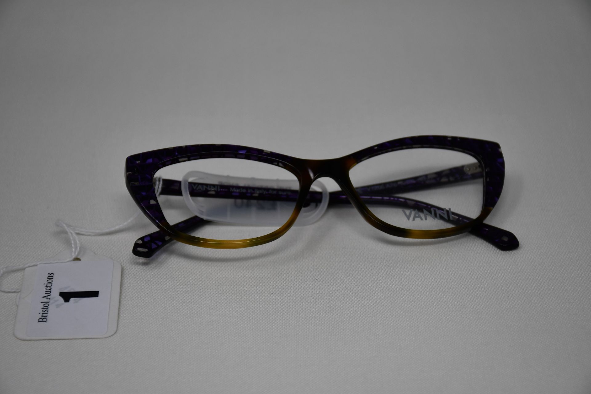 A pair of as new Vanni glass frames with clear glass (One missing) (RRP £240).