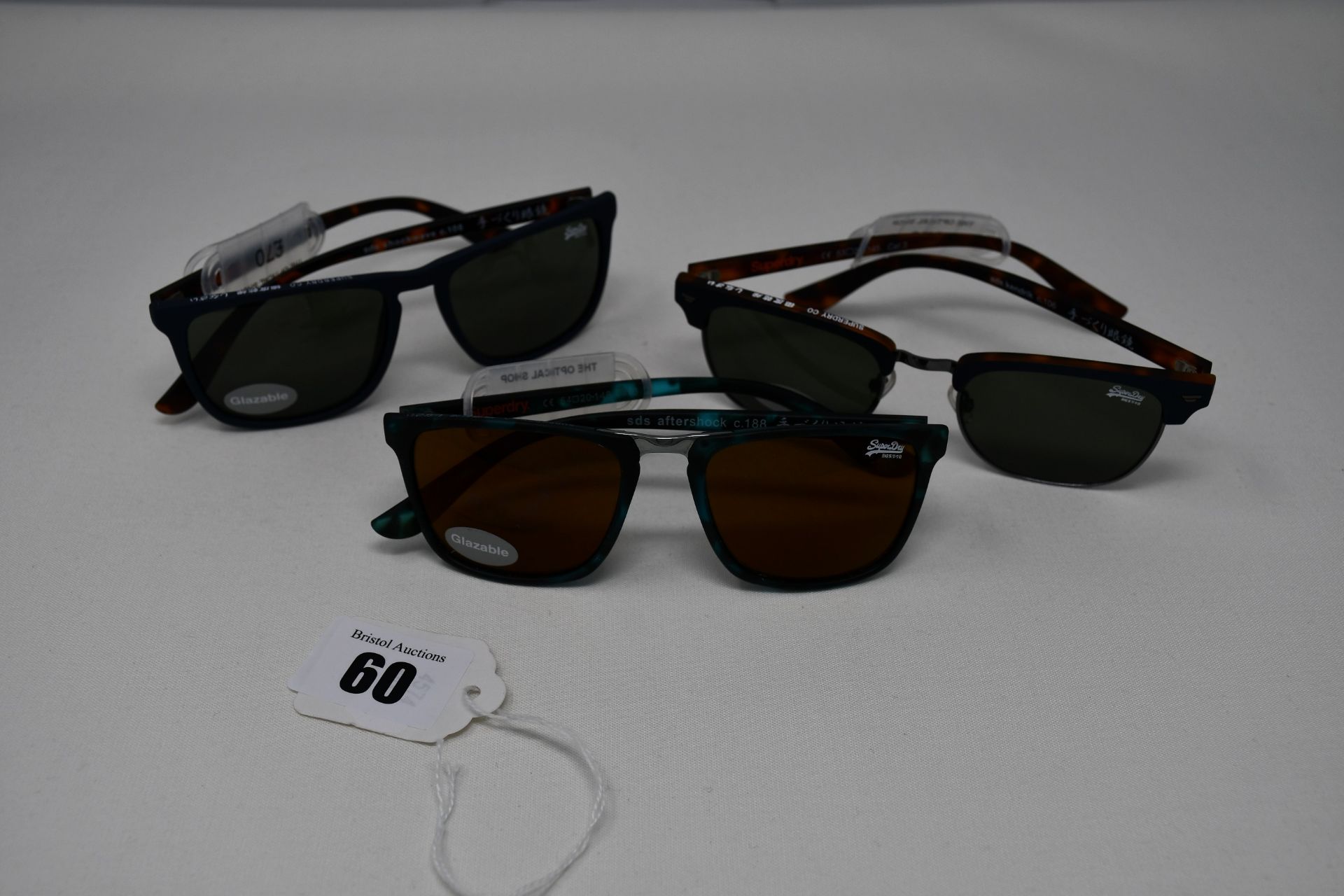 Three pairs of as new Superdry sunglasses (RRP £70 each).