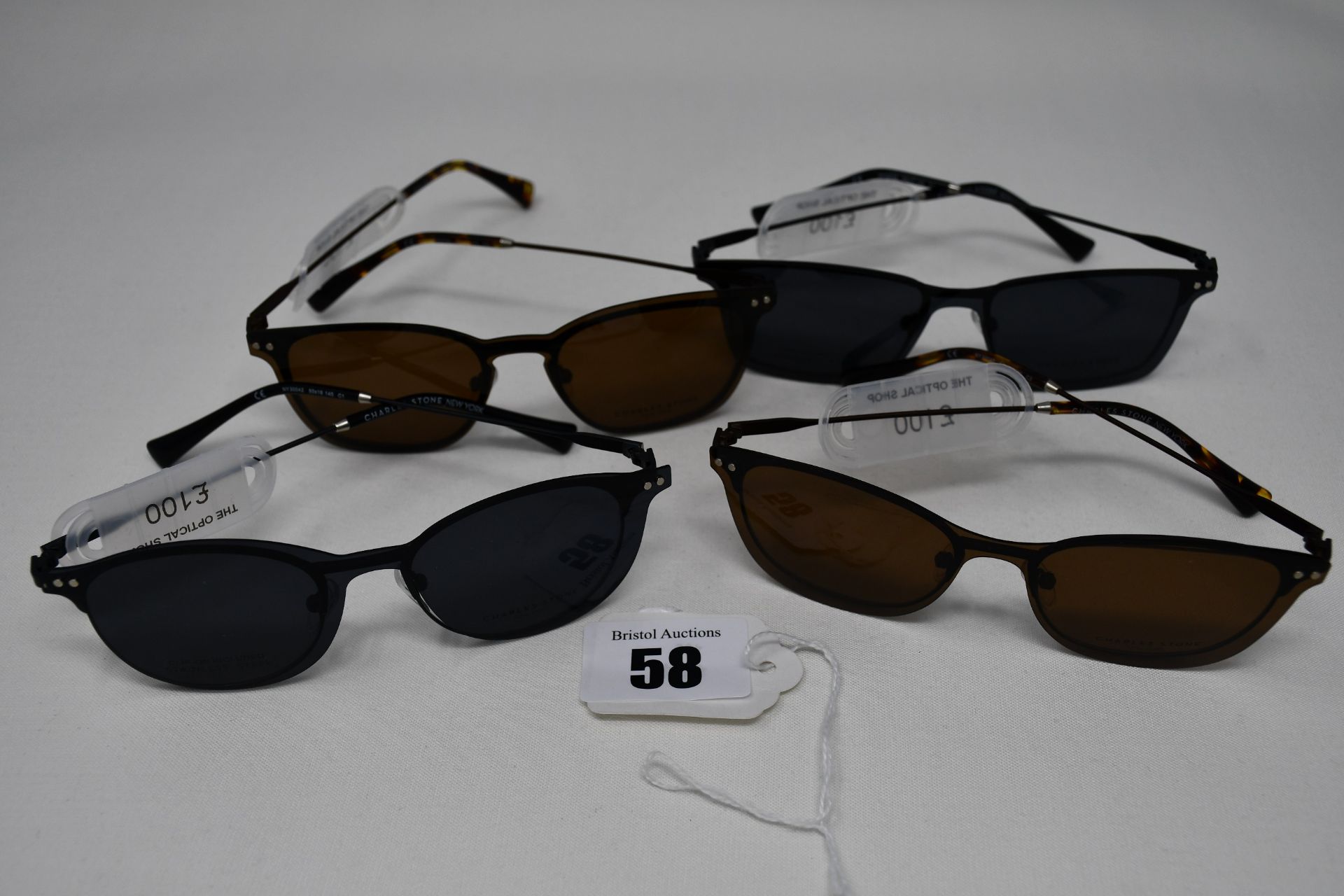 Four pairs of as new Convertibles glasses frames with clear glass and magnetic sunglasses clip (