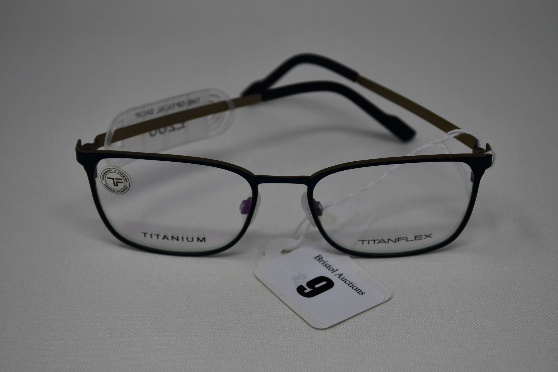 A pair of as new TitanFlex glasses frames with clear glass (RRP £200).