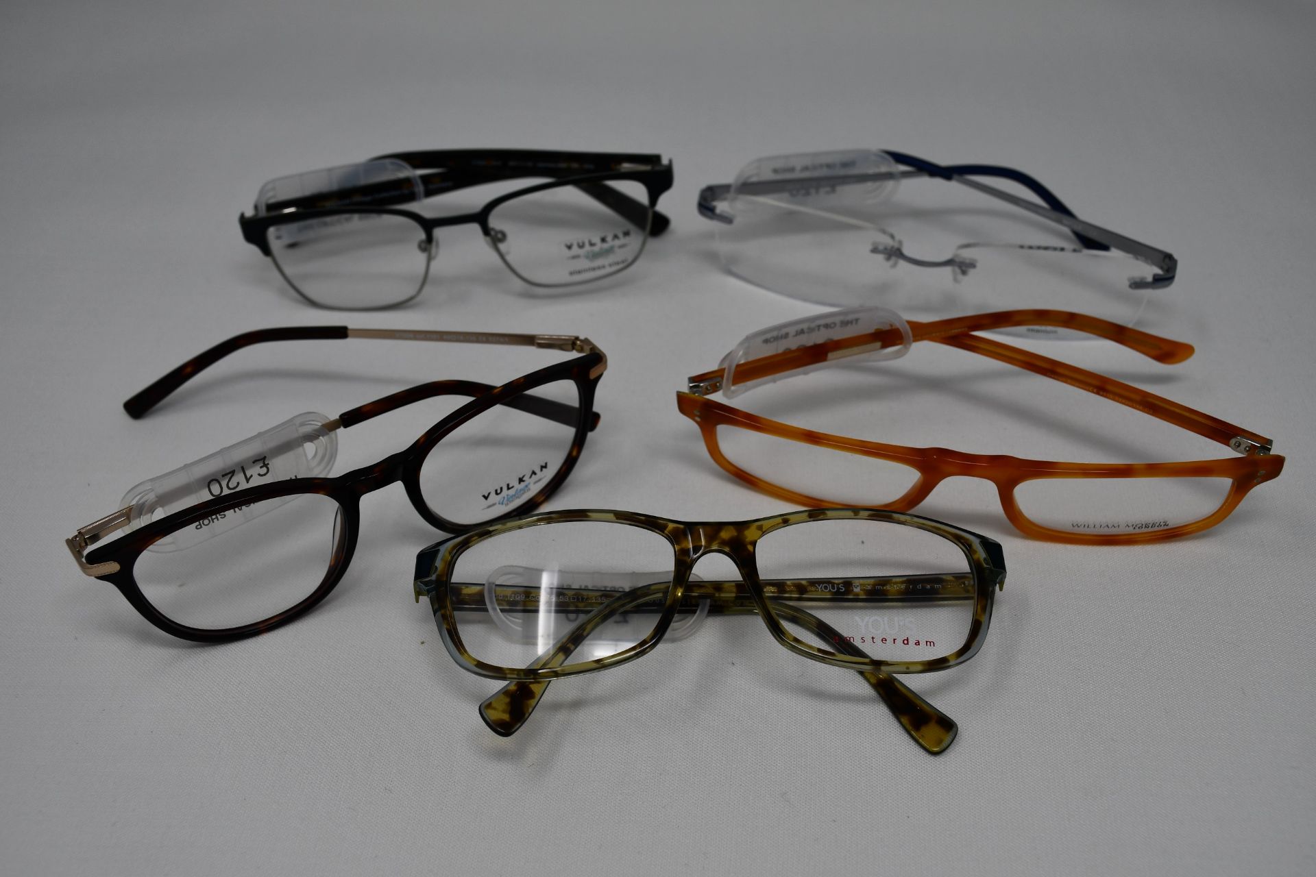 Five pairs of as new glasses frames with clear glass to include Yous, William Morris, Wolf and