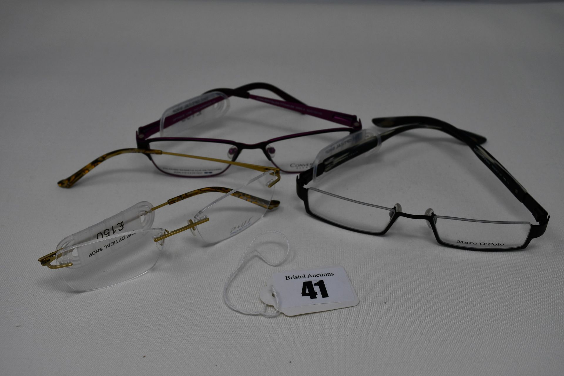 Three pairs of as new glasses frames with clear glass; Marc O'Polo, P+US and Convertibles (RRP £