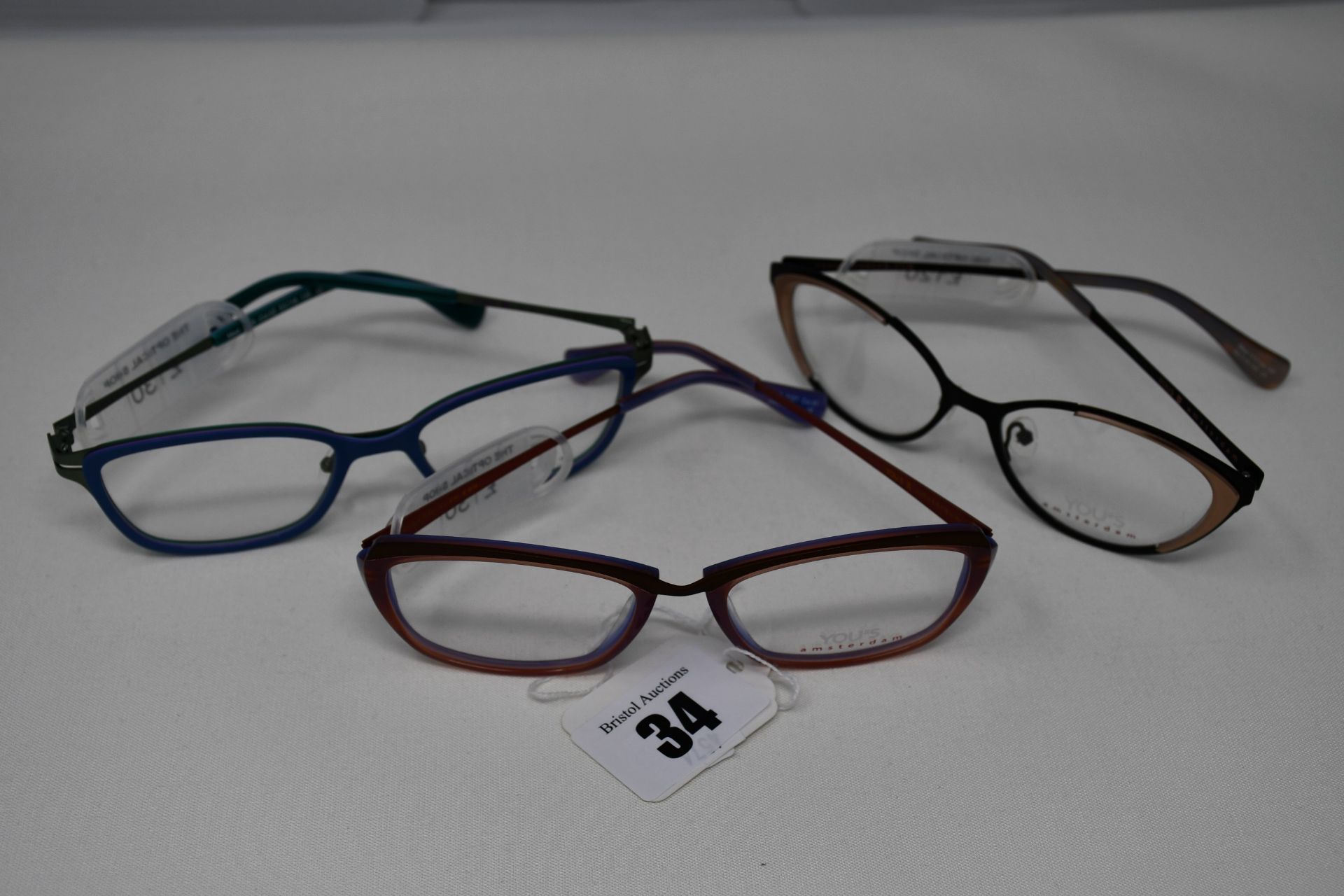 Three pairs of as new You's glass frames with clear glass (RRP £120-£130 each).