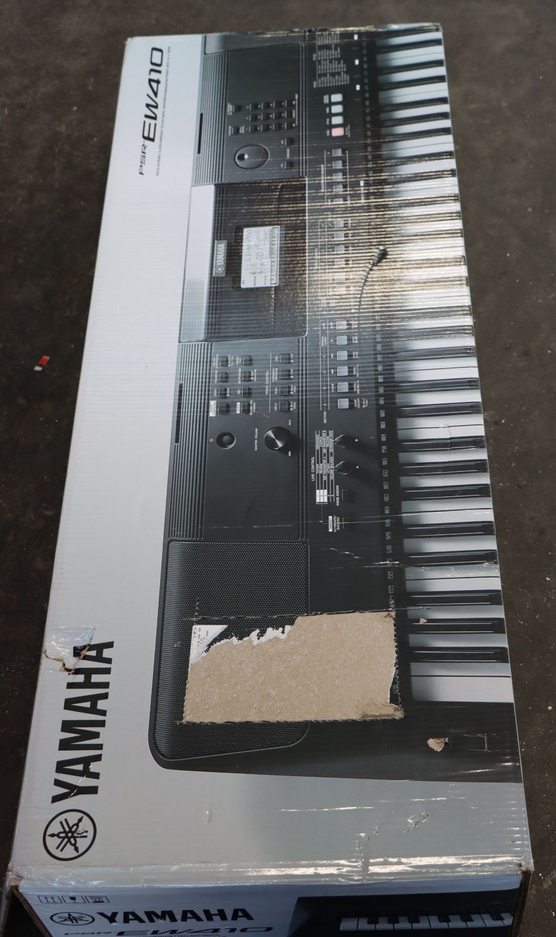 A boxed as new Yamaha PSR EW410 keyboard.