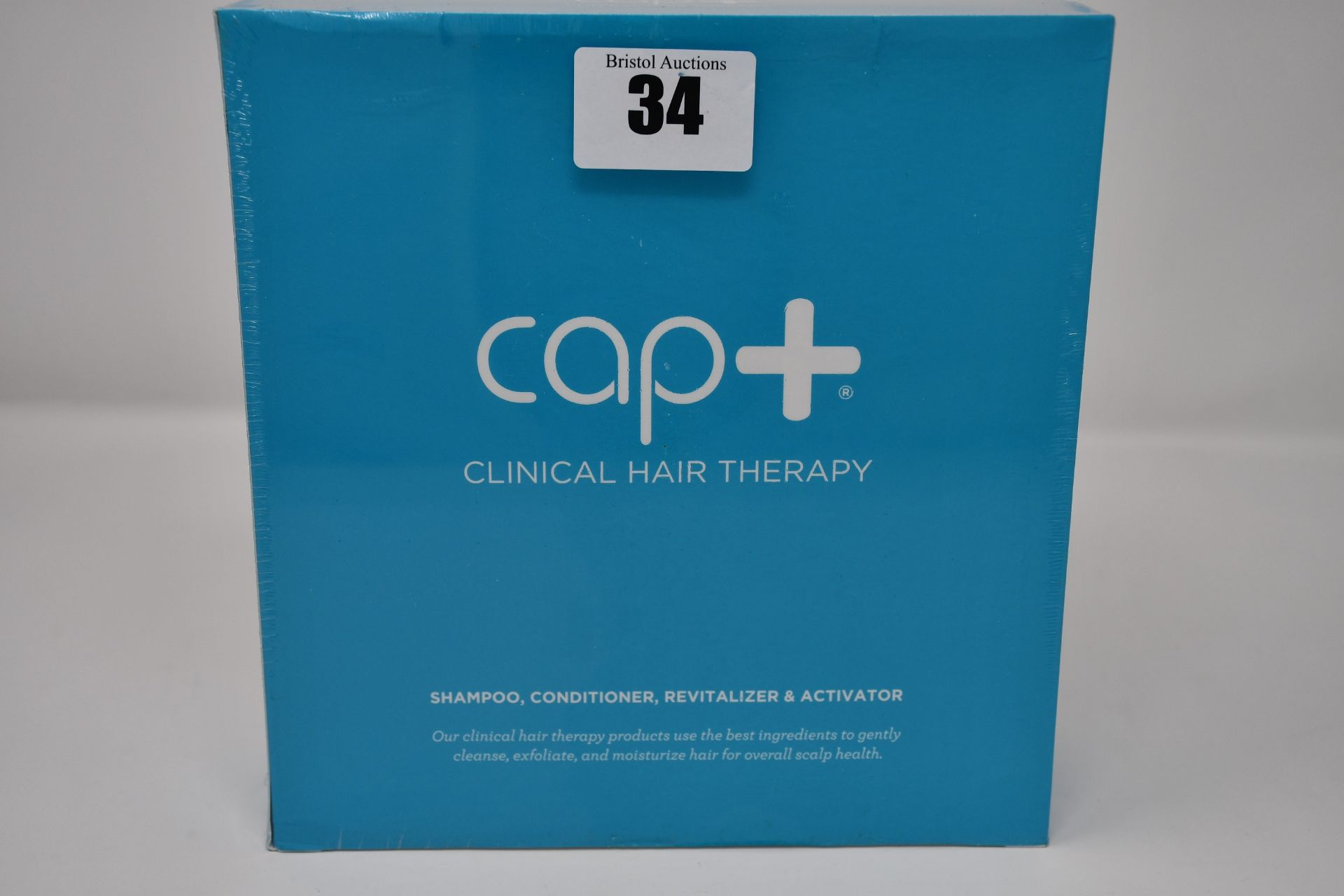 Two boxed as new Capillus cap+ clinical hair therapy bundles (Includes shampoo, conditioner,