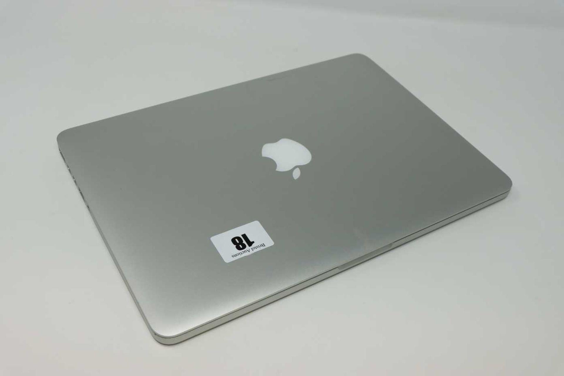 A pre-owned MacBook Pro Retina A1502 sold for parts (Serial: C02QH23WFVH5) (Powers on and