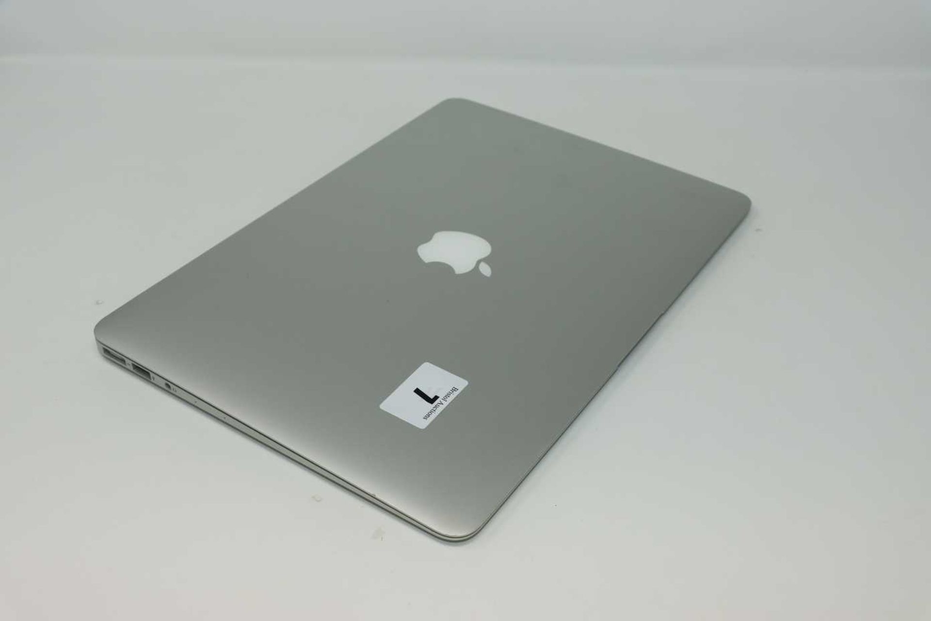 A pre-owned MacBook Air A1466 sold for parts (Serial: FVFV4HF0J1WI) (Does not power on. Liquid